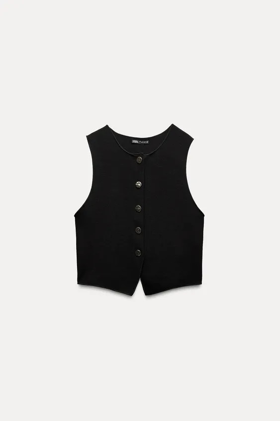 Knitted vest top. Featuring a round neck, sleeveless design, an asymmetric hem and a front fasten... | Zara UK