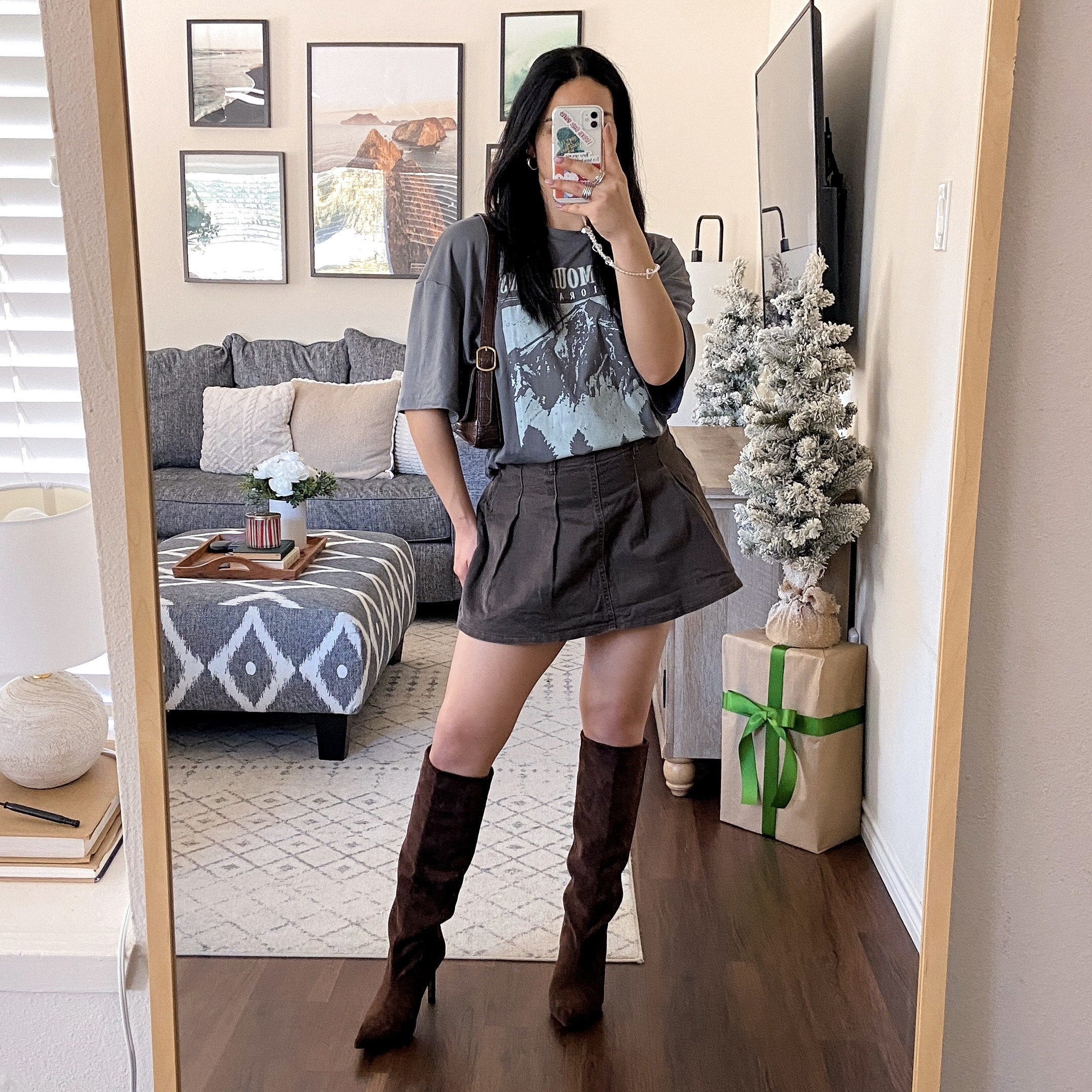 i’m wearing this tshirt in a size large and it fits true to size. it’s very oversized. wearing the skirt in a size large and it fits like a medium. it also has built-in shorts. wearing the boots in a size US8 and they fit true to size  

#LTKSeasonal #LTKCyberWeek #LTKHoliday