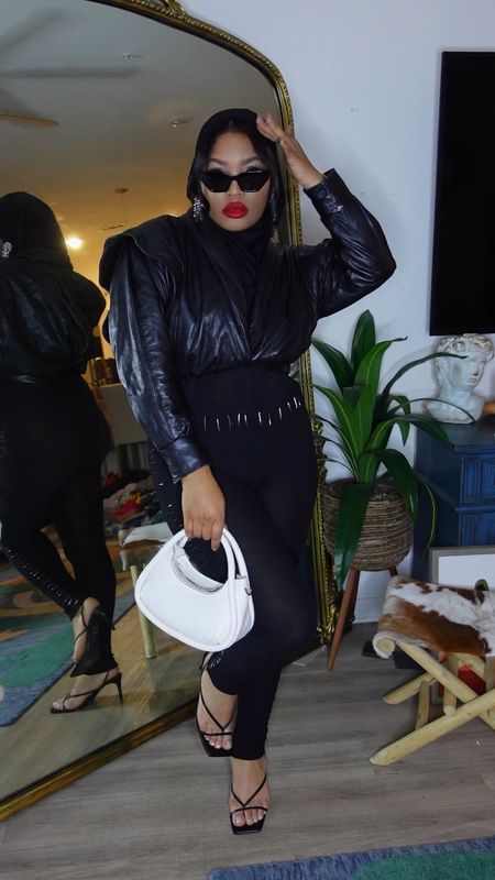 Beyonce inspired all black outfit, vintage leather moto jacket, white purse, red lip 

#LTKstyletip #LTKSeasonal #LTKHoliday