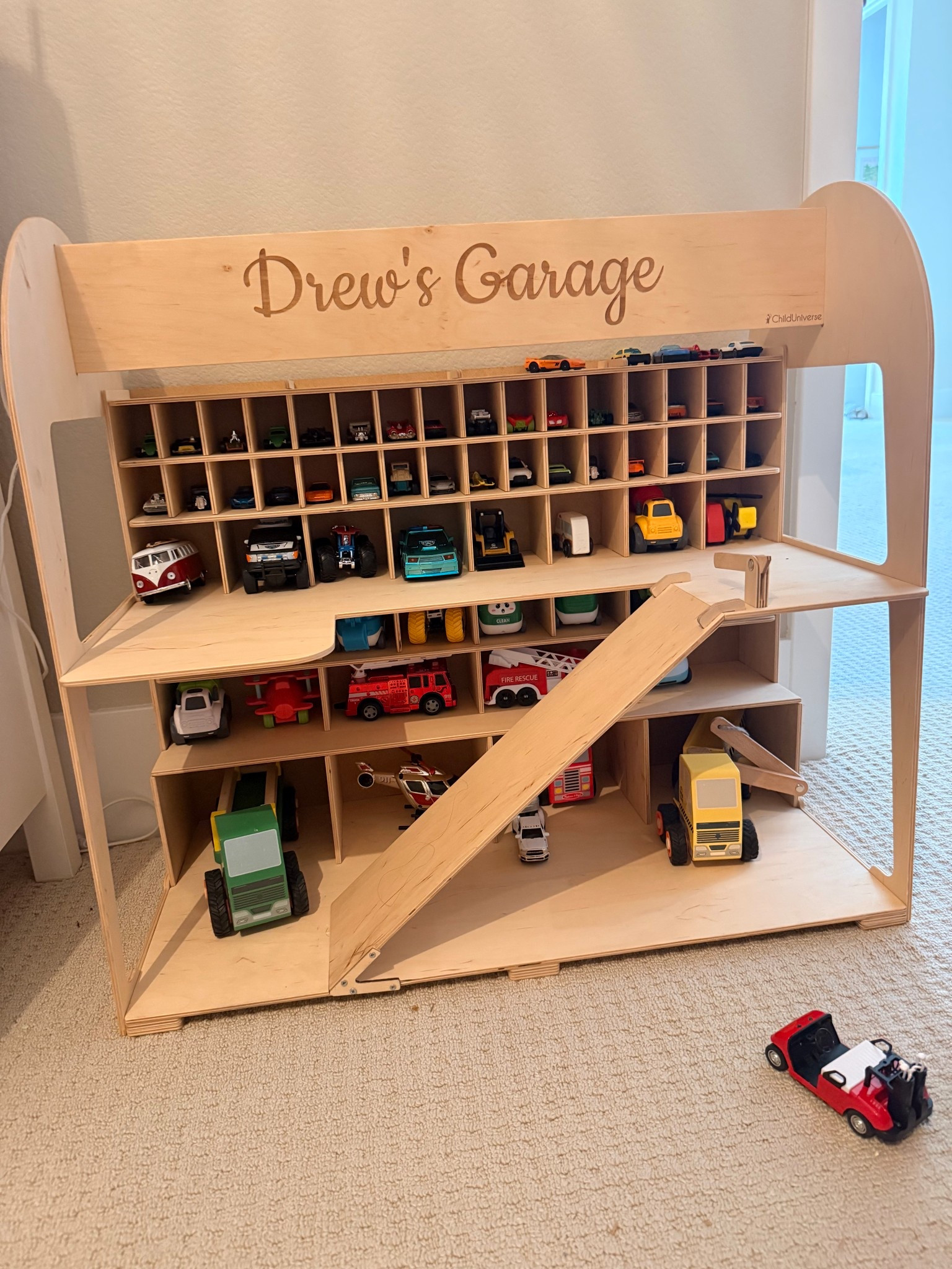 Our newest toddler obsession right now! The toy car garage #playroomodeas #toddler #playroomstorage #toystorage 

#LTKKids #LTKmomlife #LTKHome