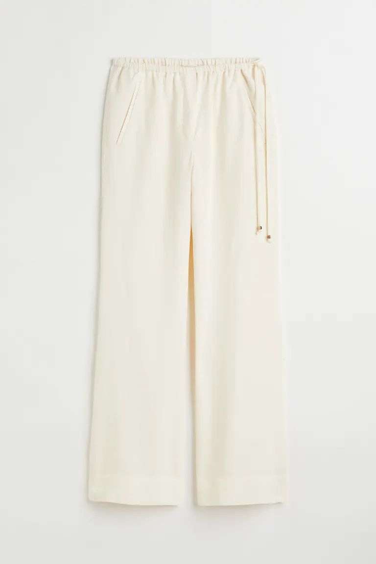 Flared lyocell-blend trousers | H&M (UK, MY, IN, SG, PH, TW, HK)