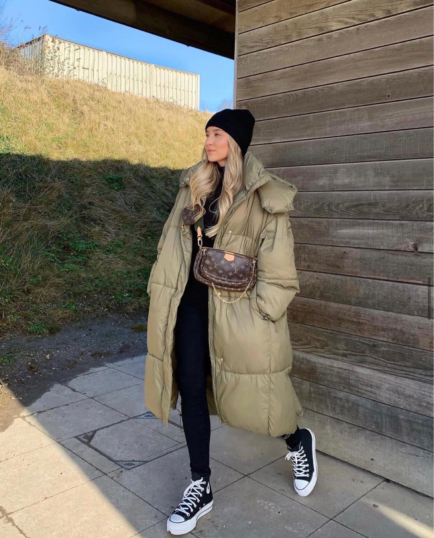 Black causal outfit with an oversized cosy coat. Khaki green long puffer jacket, black beanie hat, black roll neck jumper, black skinny jeans & black converse  

#LTKstyletip #LTKitbag #LTKshoecrush