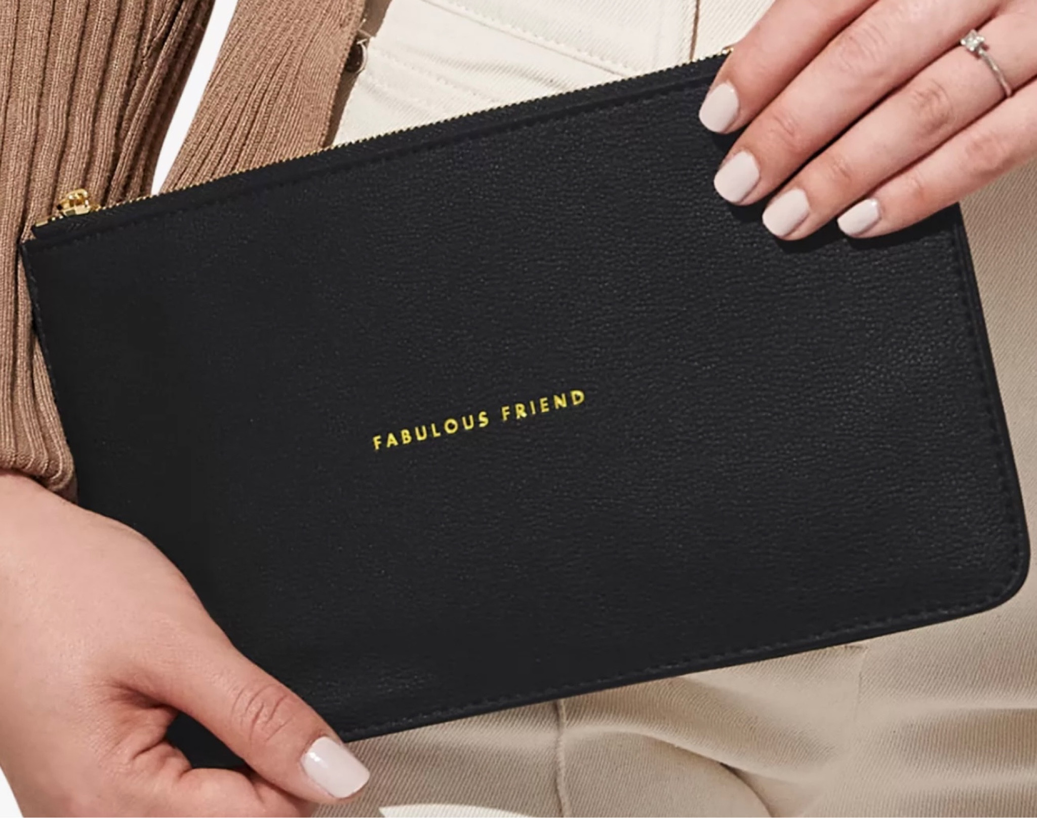 A fantastic gift idea with various embroidered sentiments like Fabulous Friend, Bride, Just Married, Flower Girl, Wonderful Mum, Bridesmaid & many more!
All linked below  
Keep your personal belongings close to hand in the most stylish way with this Slim Perfect Pouch from Katie Loxton. Featuring a brand-new design with a slimmer size to seamlessly fit inside any handbag. This style is designed with black vegan leather, a branded zip pull and the golden embroidered sentiment 'Fabulous Friend'. The most luxurious gift for every special occasion!

#LTKstyletip #LTKHoliday #LTKGiftGuide