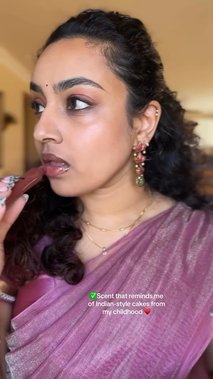 A perfect dessert in a little tube 🙌🏽 loving the @kulfi.beauty Snack Gloss Balm in Black Forest Cake with its perfectly sweet scent, sheer but perfect tint that’s just my lip color but better, and moisture that keeps my lips happy for hours! 

#KulfiBeauty #sandiegocreator #nanoinfluencer #SouthAsianBeauty #beautytok #gloss #kulfibesties