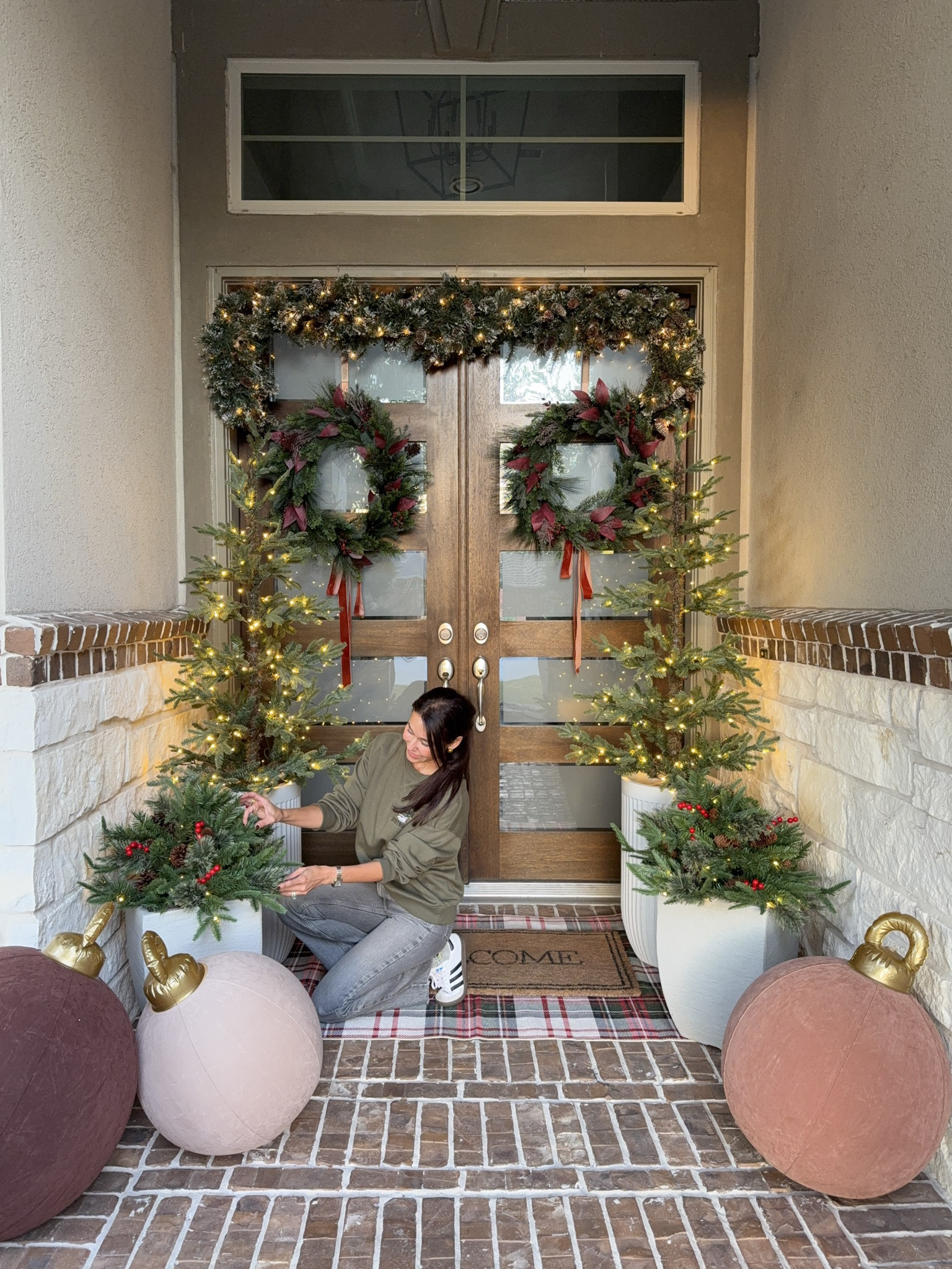 Adding the final festive touches to the porch! Garland, ribbon, and soft twinkle lights for that cozy holiday glow. The oversized ornaments and fresh greenery make this space feel so warm and inviting. Christmas porch decor, outdoor Christmas decorations, holiday porch ideas, front porch Christmas trees, festive outdoor rug, Christmas wreaths, cozy outdoor holiday decor beige white gray

#LTKSeasonal #LTKHome #LTKHoliday