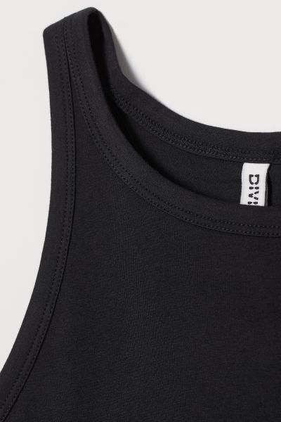 Fitted tank top in soft cotton jersey with a racer back. | H&M (US + CA)