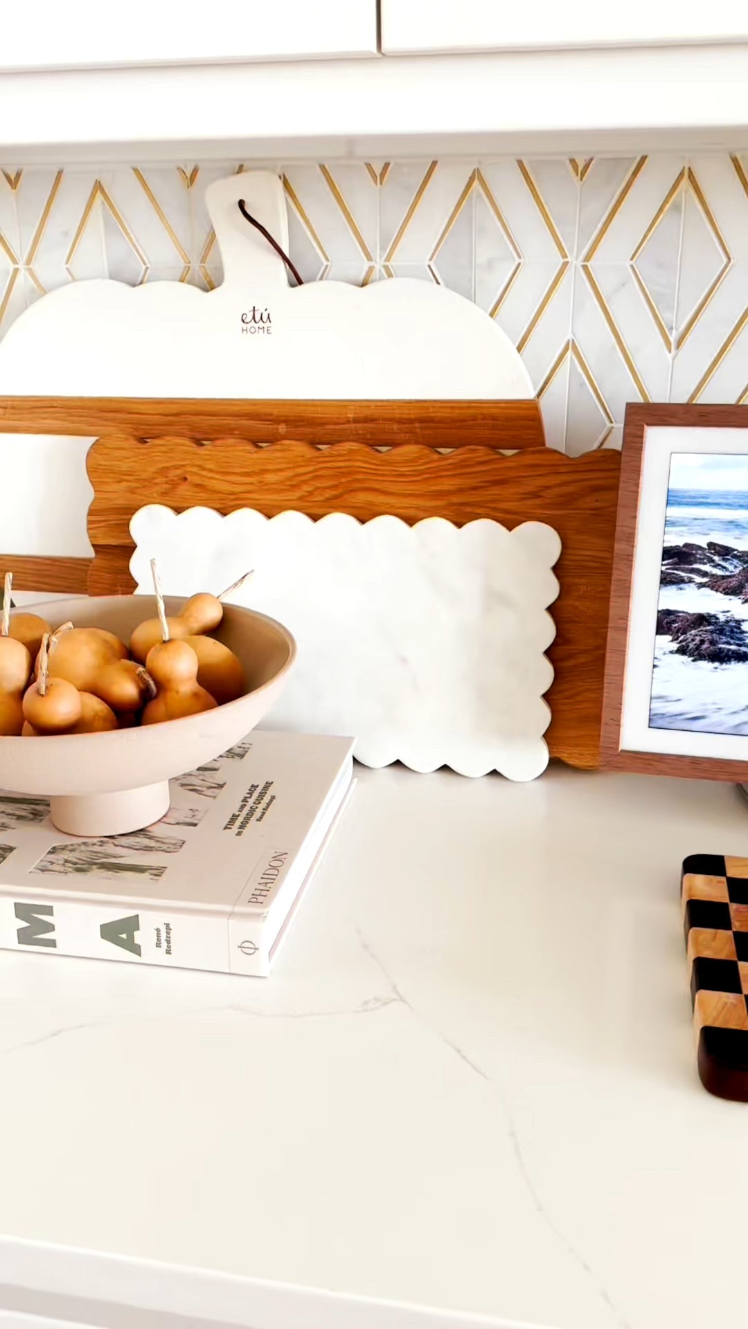 🍂 added these simple dried gourds to this corner of our kitchen for the perfect neutral organic touch 🍂

Adding natural elements is a perfect way to add warmth for the autumn season.

Scallop wood trays, pumpkin charcuterie board, layering is another perfect way to add fall touches, checkered cutting board, pedestal decorative bowl, pedestal fruit bowl, 

#LTKSaleAlert #LTKSeasonal #LTKHome