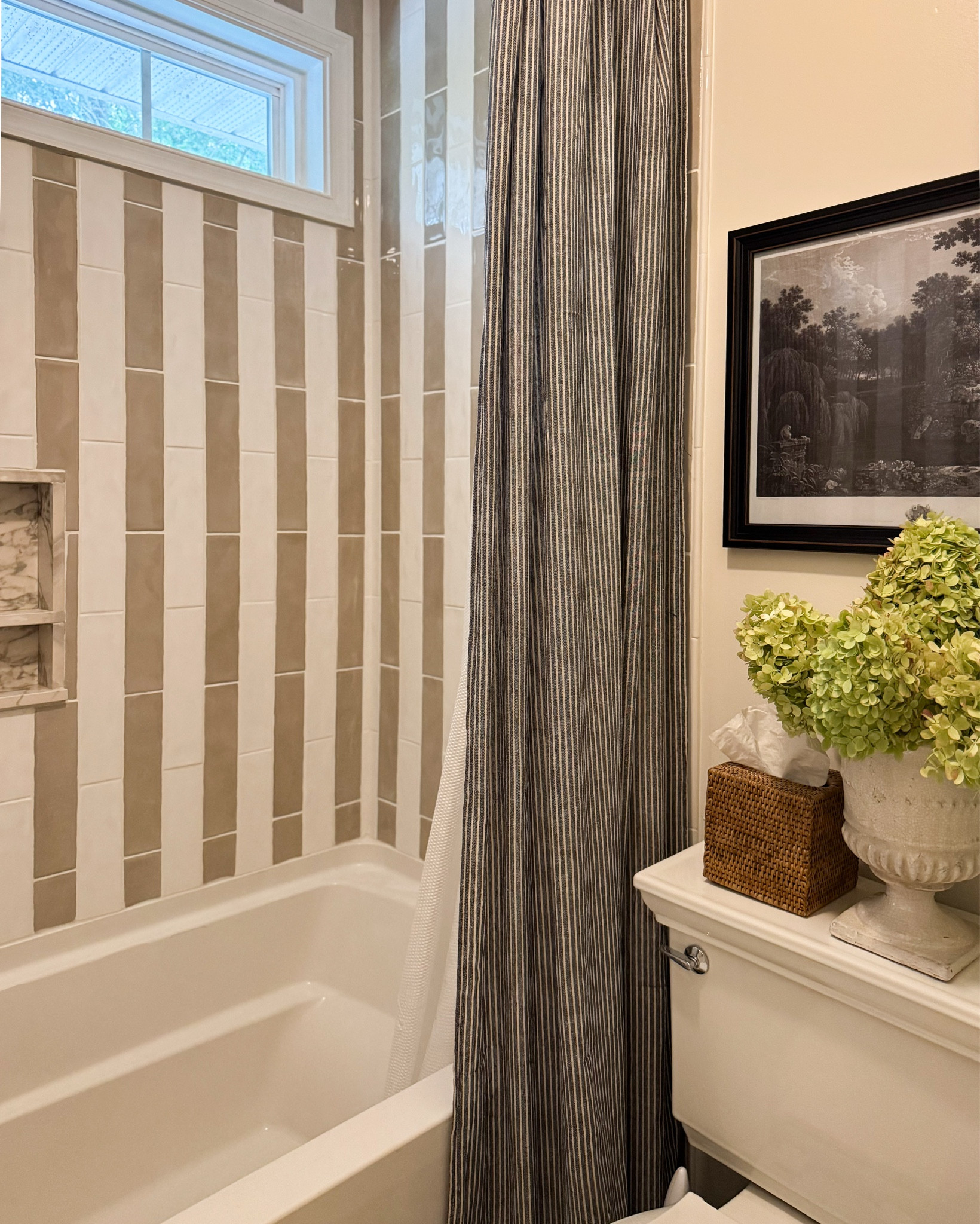 ✨BATHROOM REVEAL✨

I gave this space a whole new look without removing the old tub, floor tile, or vanity. Can you believe that?!? 😍The last untouched room in my house was the kid’s bathroom and this one truly turned out SO special. 

Paint 👇🏻
Swiss Coffee by Behr
Anew Grey by Sherwin Williams
Aplomb By Benjamin Moore

Tile by @daltile from @homedepot
Countertops are Porcelain from @homedepot

👉🏻Rug, stool, and mirrors are vintage!

#bathroomrenovation #bathroominspo

#LTKFamily #LTKHome #LTKStyleTip