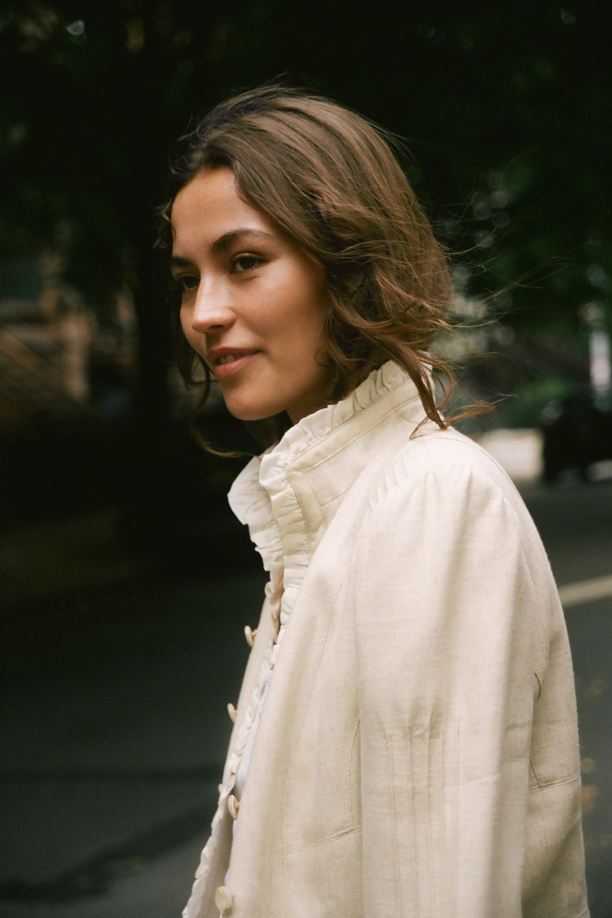 Open blazer featuring ruffles, long sleeves with shoulder pads, and pintuck detailing. Faux front... | Zara US