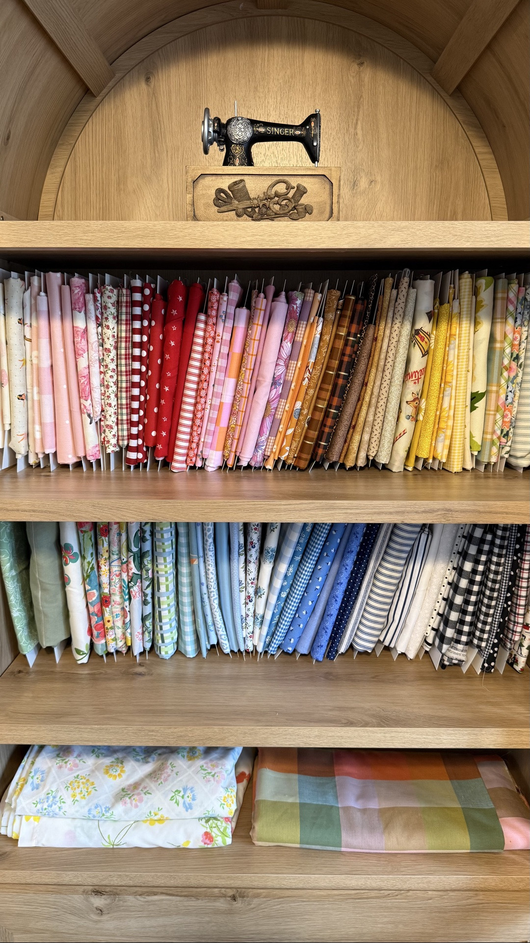 fabric storage + display cabinet with fabric organizer boards 

craft room, craft room organization, sewing room, arched cabinet, glass display cabinet

#LTKHome