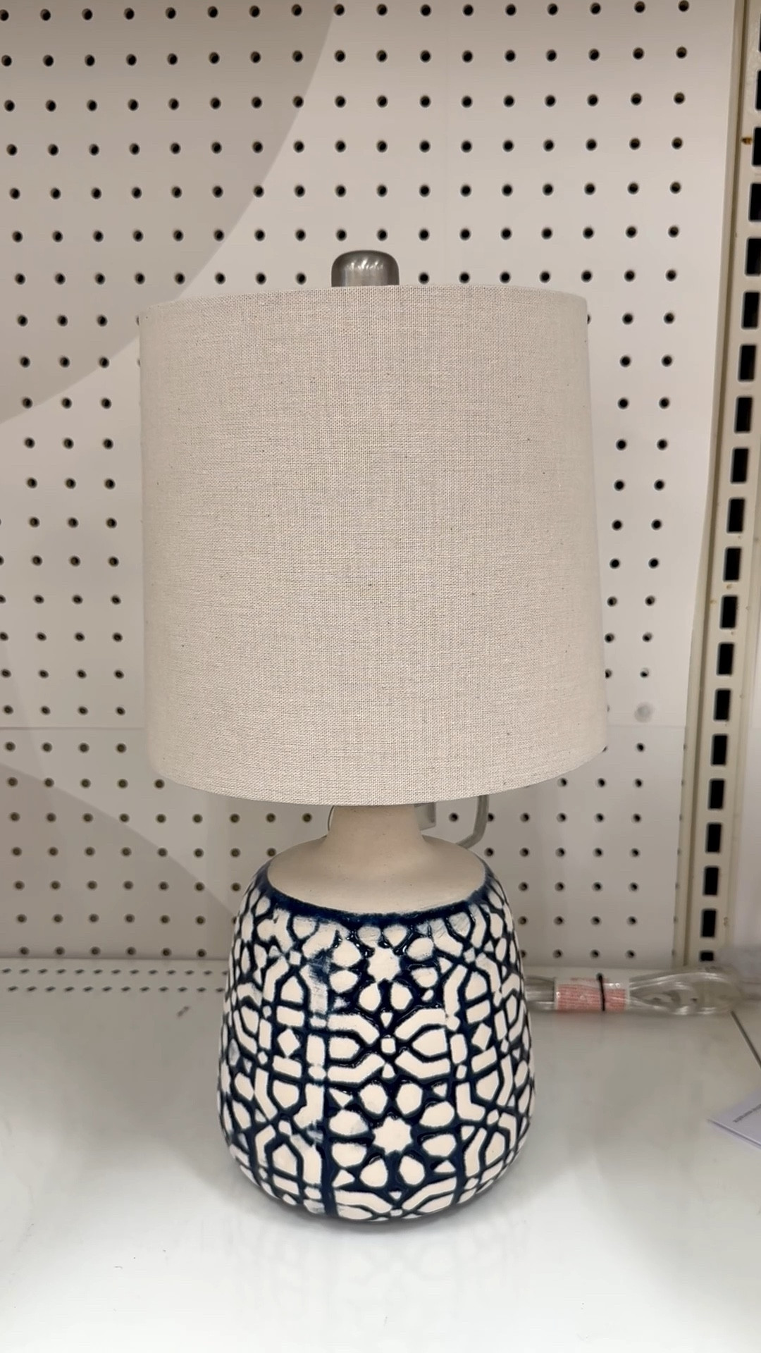 One easy way to change the look of a room is by swapping out your table lamps. The base of this lamp is ceramic and features a textured, abstract design in navy and white. The cone-shaped lamp shade is a flax color. Together they’re super cute and feel right for the upcoming warm-weather months.

#tablelamp #ceramiclamp #blueandwhitelamp #target #bedsiddetablelamp #abstractdesignlamp #homeofficelamp #kitchenlamp #lampsunder$40

#LTKHome