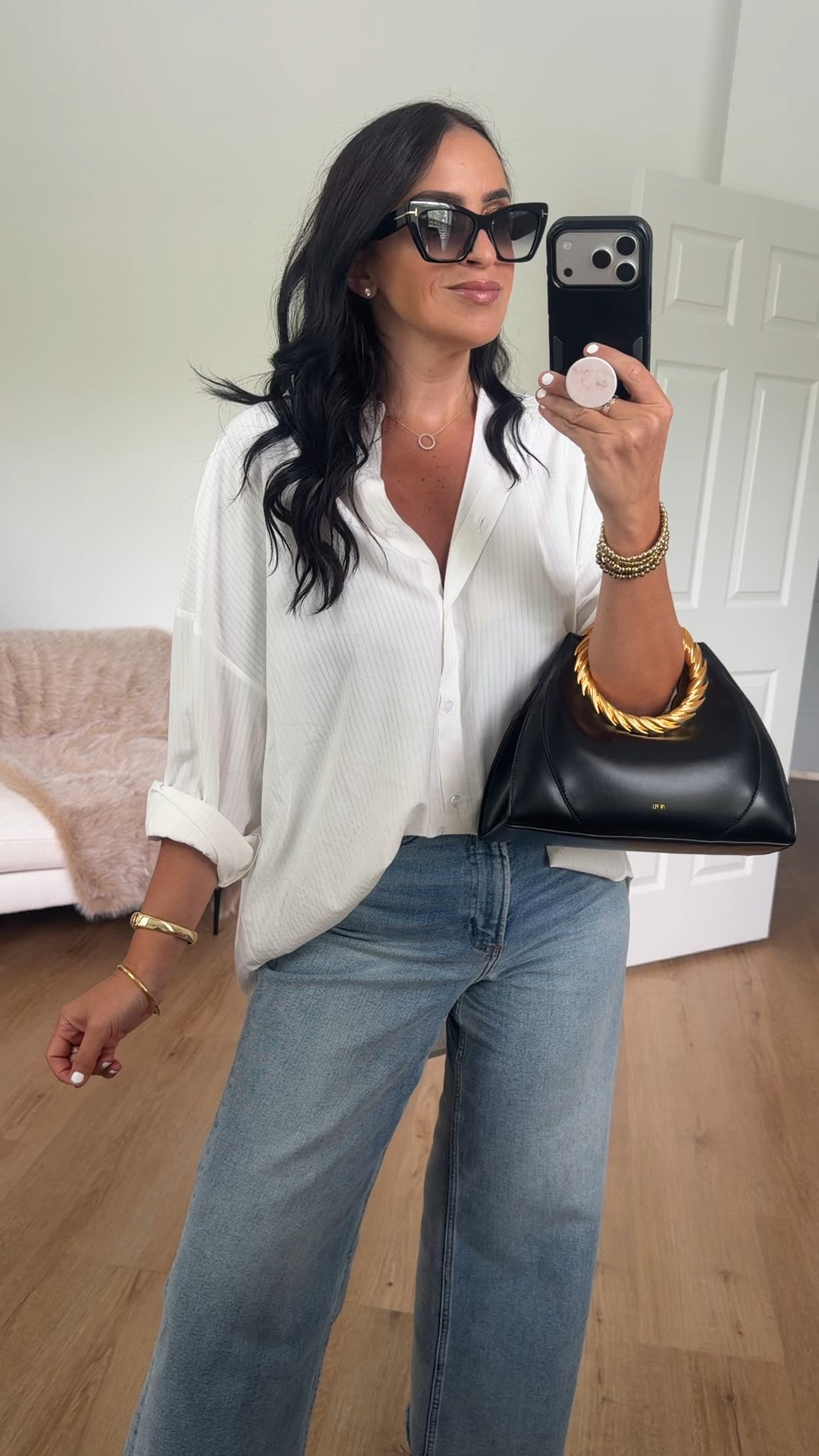 Wearing size small. The link makes it look more gray but it’s white