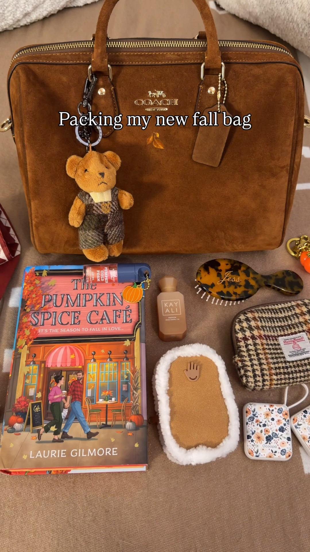 What’s in my bag 🍂Fall Edition🍂
What fits in the large suede Rowan 🍂 Comment SHOP & I’ll dm you the links ♥️

Pumpkin spice cafe fall book
Harris tweed pouch
KayAli mini travel perfume
Bath and body works pumpkin cold foam lip oil
Fall bandaids
Rare beauty mini blush
Personalized hairbrush from Etsy
Magnetic power bank from Burga with romantasy pattern
Clear kisslock pouch
Rechargeable hand warmers
Earphones with jewels on them
Mini cleaning wipes
Washable lint roller
Coach outlet wallet
Suede brush
Scarf
Pumpkin charm
