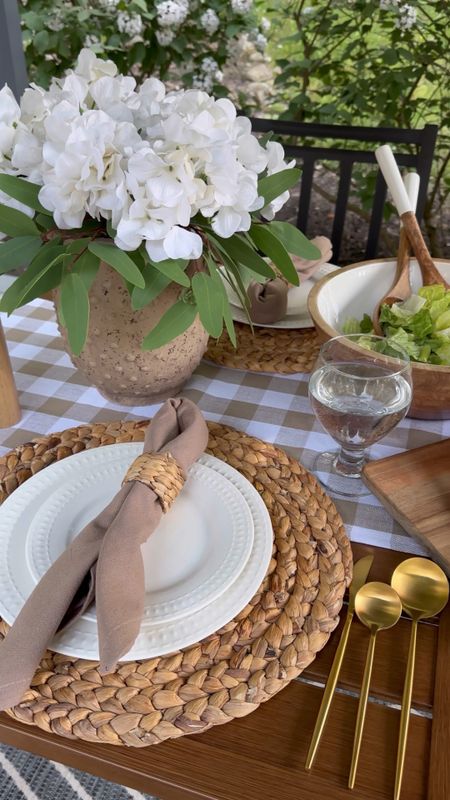 Outdoor Table and Chairs Set. Follow @farmtotablecreations on Instagram for more inspiration. Table, Swivel Chairs, Bench on sale. Table Setting. Table decor. Checkered runner. Wicker placemats. Entertaining pieces. Serving pieces. 

#LTKsalealert #LTKhome #LTKunder50