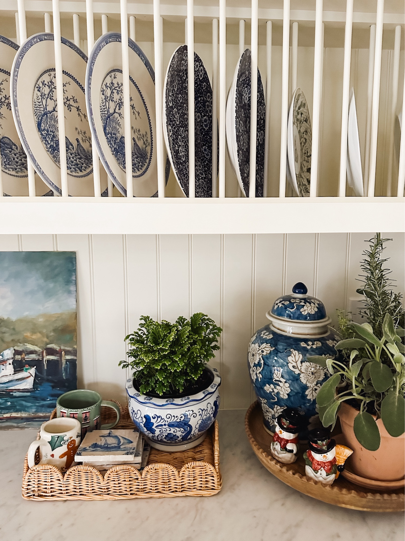 Kitchen plates, blue white planter pot, scalloped wicker tray. Wood lazy Susan, blue white Ginger jar 

#LTKhome #LTKSeasonal #LTKHoliday