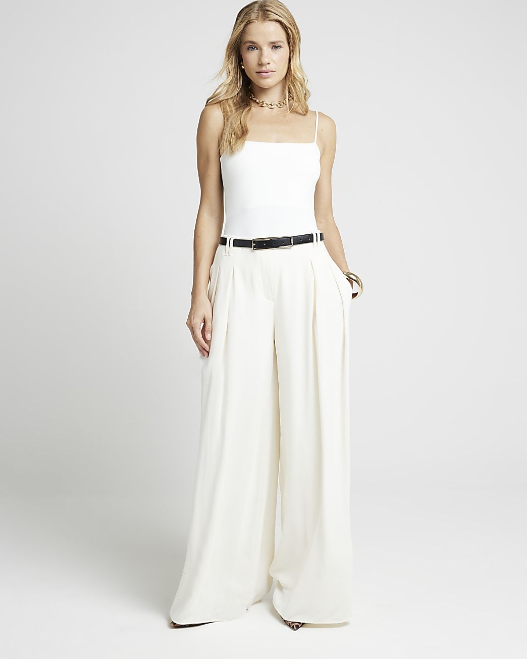 Cream pleated wide leg trousers | River Island (UK & IE)