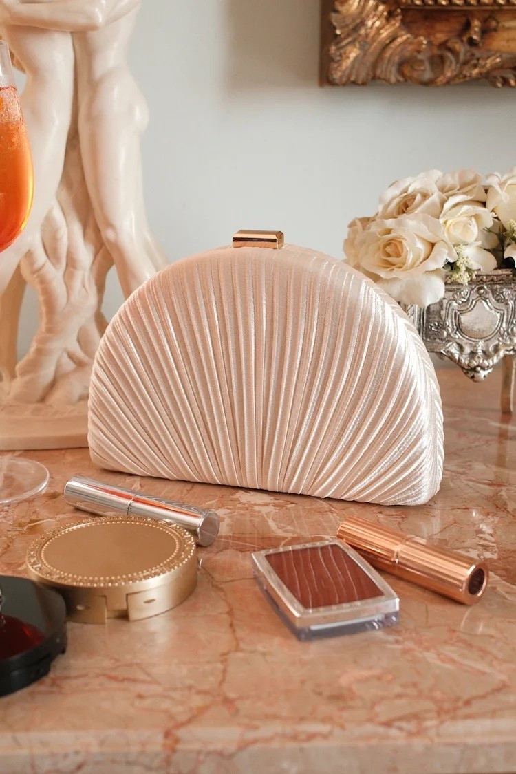 This champagne satin pleated clutch combines elegant texture with a structured silhouette, creating the perfect finishing touch for weddings, cocktail parties, and elevated evening looks ✨🥂 Under $40.

Keywords:

* ivory crossbody clutch
* textured clutch bag
* neutral handbag
* elegant crossbody purse
* minimalist clutch
* evening crossbody bag
* women’s occasion handbag
* chic ivory accessory
* wedding guest accessories
* European summer fashion
* vacation handbag
* brunch outfit accessories
* day to night styling
* elevated casual fashion
* resort chic aesthetic
* feminine neutral fashion

#LTKTravel #LTKWedding #LTKgrwm