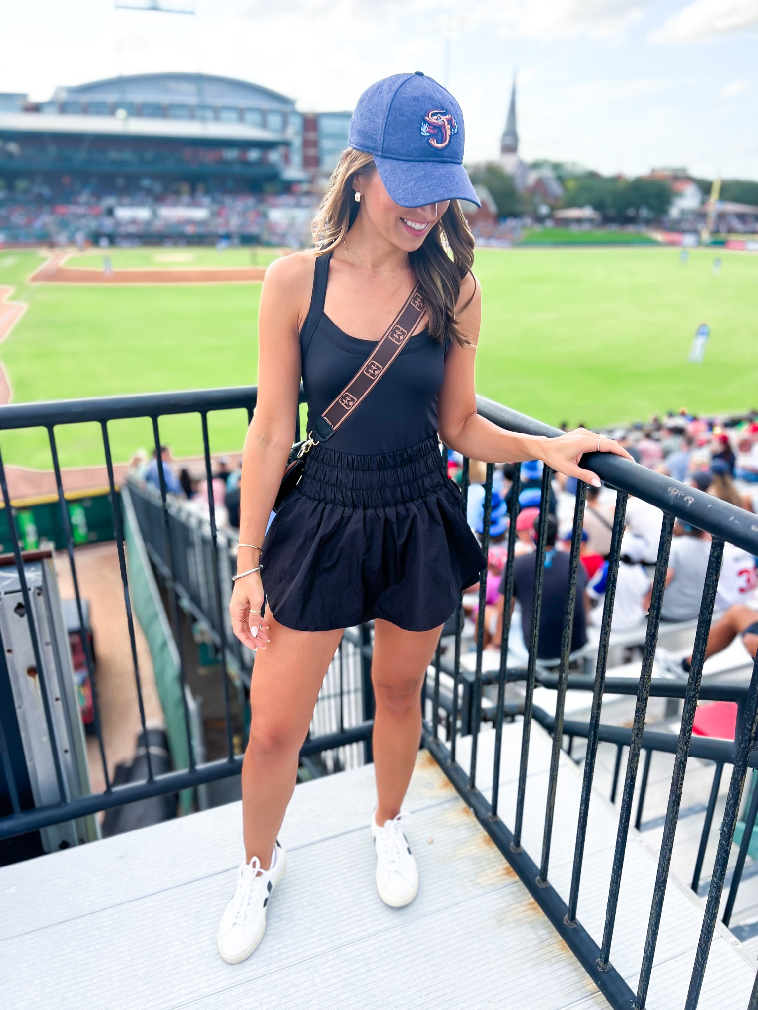 Amazon skort dress. Baseball game outfit. Baseball mom outfit. Free people inspired dress. Amazon athletic dress. Black skirt dress. Amazon belt bag. Veja Esplar sneakers (size down if you’re a half size). Casual outfit. Athleisure. Mom outfit. 

#LTKfitness #LTKshoecrush #LTKfindsunder50