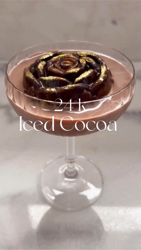 24k Iced Cocoa

Pretty drink for Valentine’s Day, date night, or for a special morning breakfast drink! 

Ingredients: 
*Cocoa powder
*Choice of milk 
*Chocolate liquor (optional)
*Ice 
*Edible gold dust

-Rose ice mold

Instructions: Mix cocoa powder with half water and half choice of milk. Sprinkle some gold dust into bottom of rose mold. Slowly pour cocoa drink mix into rose ice mold and freeze. Make a new drink mix of cocoa powder with choice of milk and add chocolate liquor (optional). Pour ice into shaker and add cocoa drink. Shake. Take frozen rose ice out of freezer and place into coupe glass. Slowly pour chilled drink into glass. Enjoy!🤎

#icedcocoa #valentinesdaydrinks #valentinesday #valentinesdaycocktail #valentinesdaycocktails #ediblegold #24kgold #morningdrinks #hotcocoa #chocolate #chocolatedrinks #chocolatecocktails #datenightdrinks #breakfastinbed #breakfastdrinks #breakfastcocktails #romanticdrinks #romanticcocktails #drinks #cocktail #cocktails #coupeglasses #glassware #icemold #icemolds #home #valentinesdayicemold #roseicemold #roseicemolds #LTKvideo




#LTKfindsunder50 #LTKhome #LTKSeasonal
