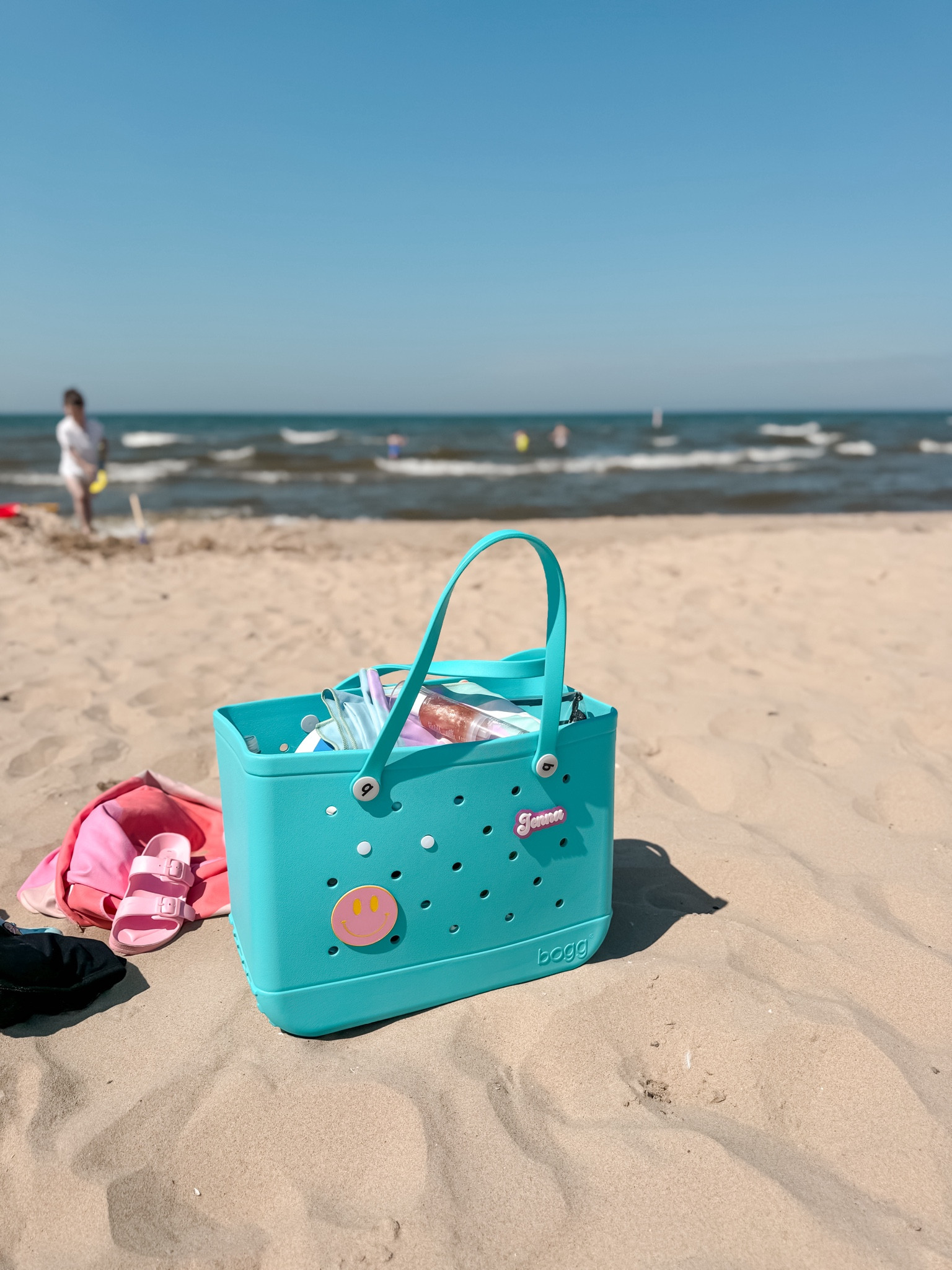 My bogg bag perfect for the beach 
It’s so roomy and I love that I can spray it with water to clean out the sand! A must have for moms this summer 
With bogg bag charms 
