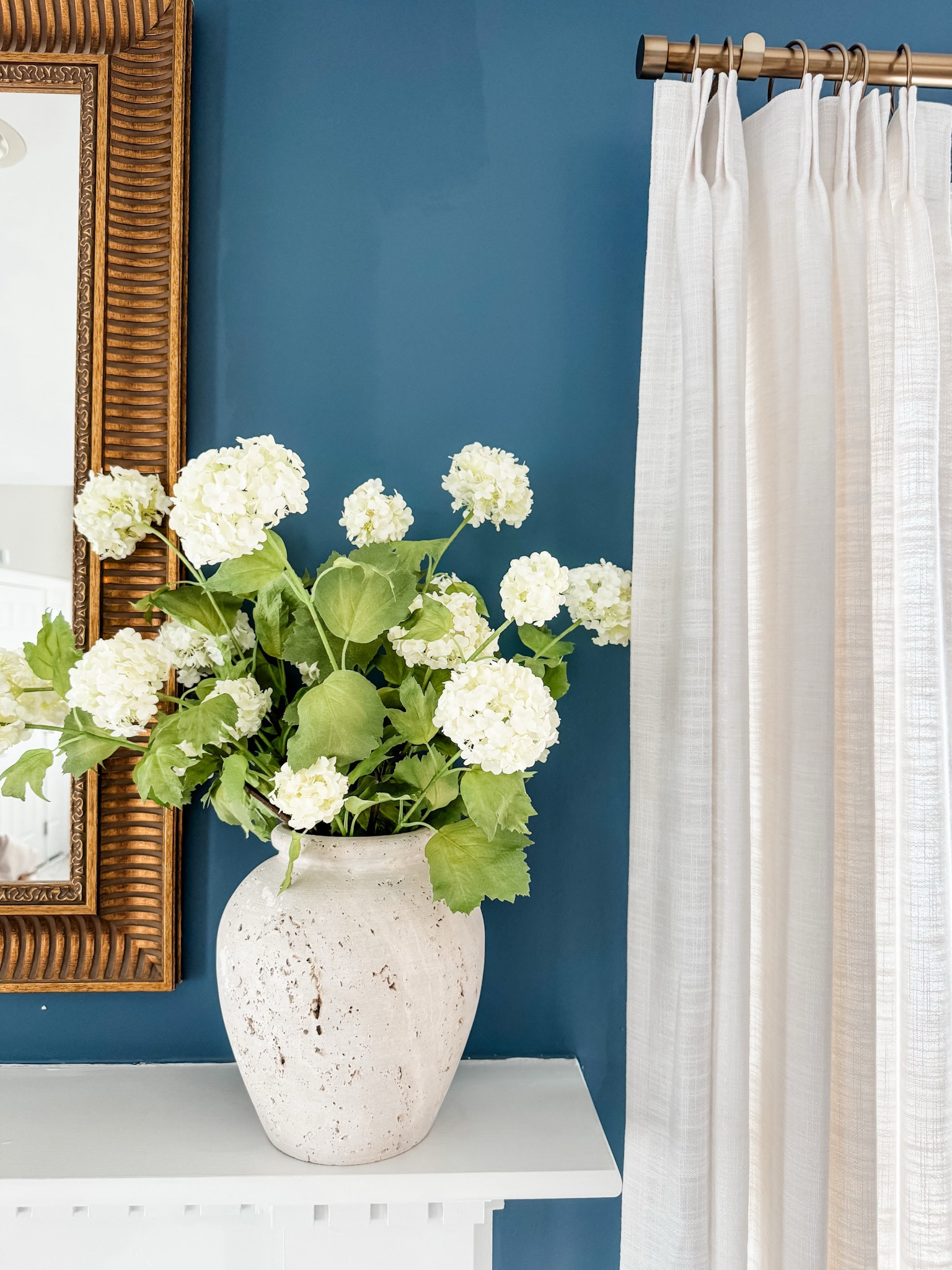 Afloral snowball flower stems
Aged vase
Pinch pleat curtains in color beige white 
End cap Amazon curtain rod 
Spring mantel decor 

#LTKStyleTip #LTKHome #LTKSeasonal