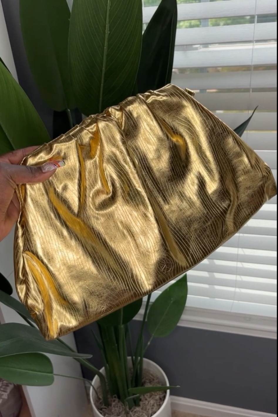gold bottega pouch dupe