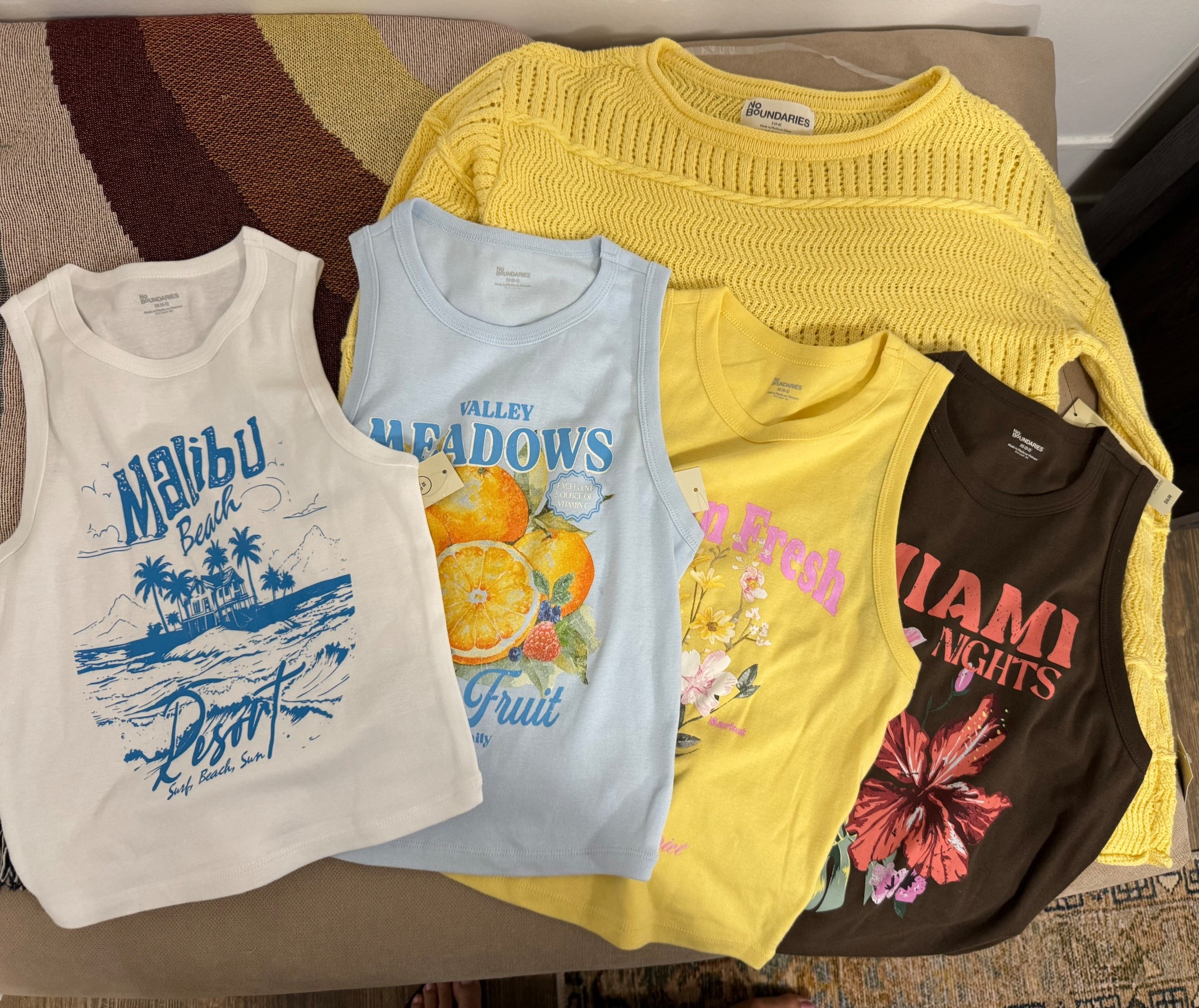 Vacation tops purchased extra small in the tanks and a small in the sweater
Tanks are $6.98