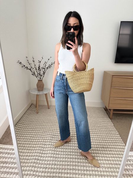 J.Crew New slim wide leg jeans. I’m in the petite so they’re more cropped. So if you want them full length, take the regular size. Super comfy and flattering. On sale! 

Tank - Free Assembly xs
Jeans - J.crew petite 24
Mules - Doen 35
Bag - Dear Keaton
Sunglasses - Celine 

Spring outfit, jean, petite style 