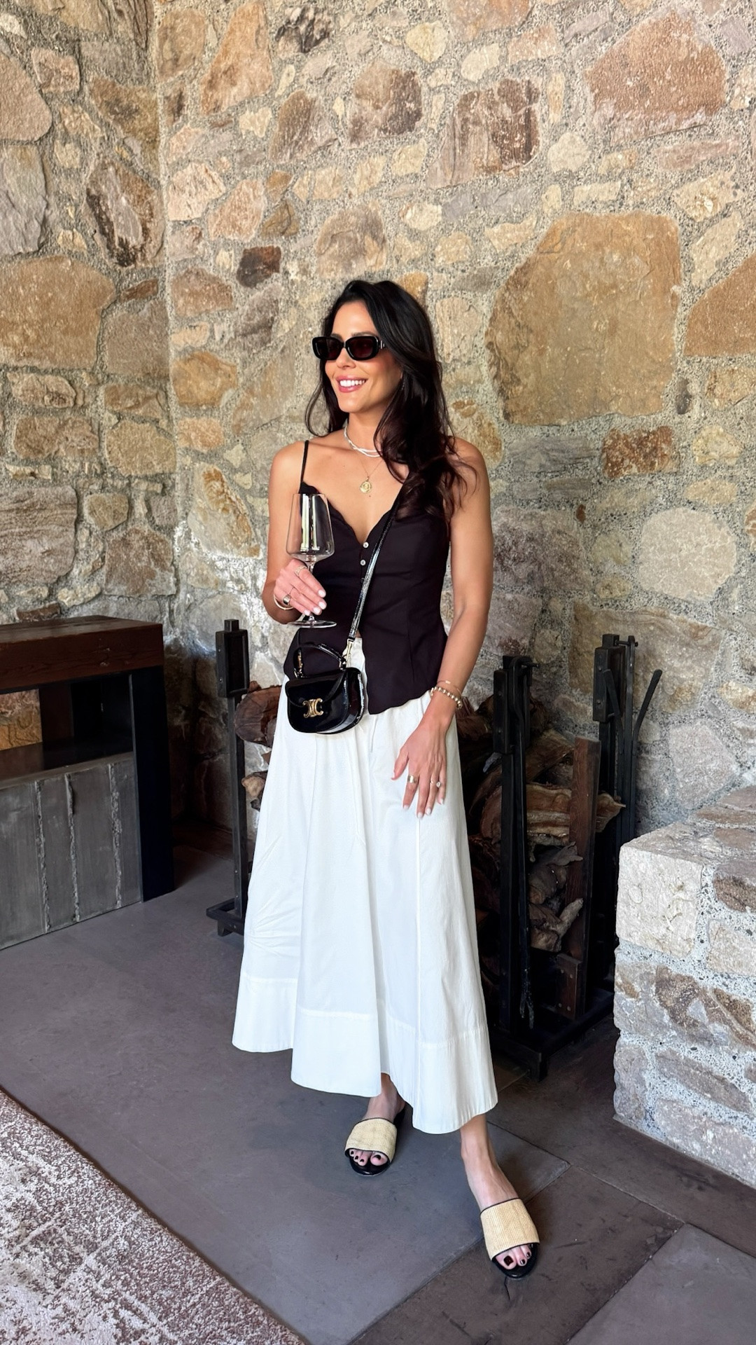 The kind of effortless summer outfit that works from wine tasting to dinner plans 🍇

This gently flared midi skirt has the prettiest movement and the most flattering fit with the adjustable drawstring waist (I sized down for a more fitted look). Paired it with this linen scalloped top with a deep v neckline and delicate button details that instantly gives that elevated European summer feel.

Finished the look with my new low profile glossy brown sunnies, bold silver hoops I wear on repeat, and my comfy Azzurra Capri raffia slides with the padded footbed that make walking through wineries all day so easy.

This entire look is exactly what I want to wear all summer long 🤍

#LTKTravel #LTKgrwm #LTKootd