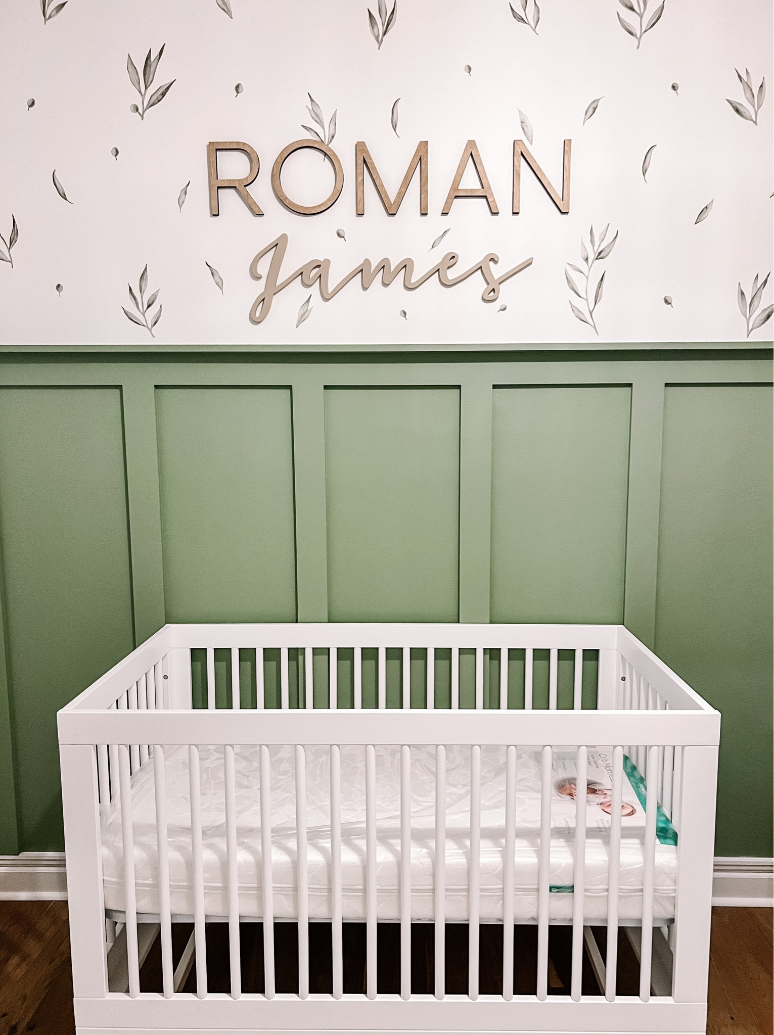 Roman’s nursery. Gender neutral baby nursery. Botanical themed nursery. Olive branches wall decor. Sage green nursery. White baby crib. Custom wooden baby name. Nursery must haves. Accent wall fox nursery. 

#LTKhome #LTKbump #LTKbaby