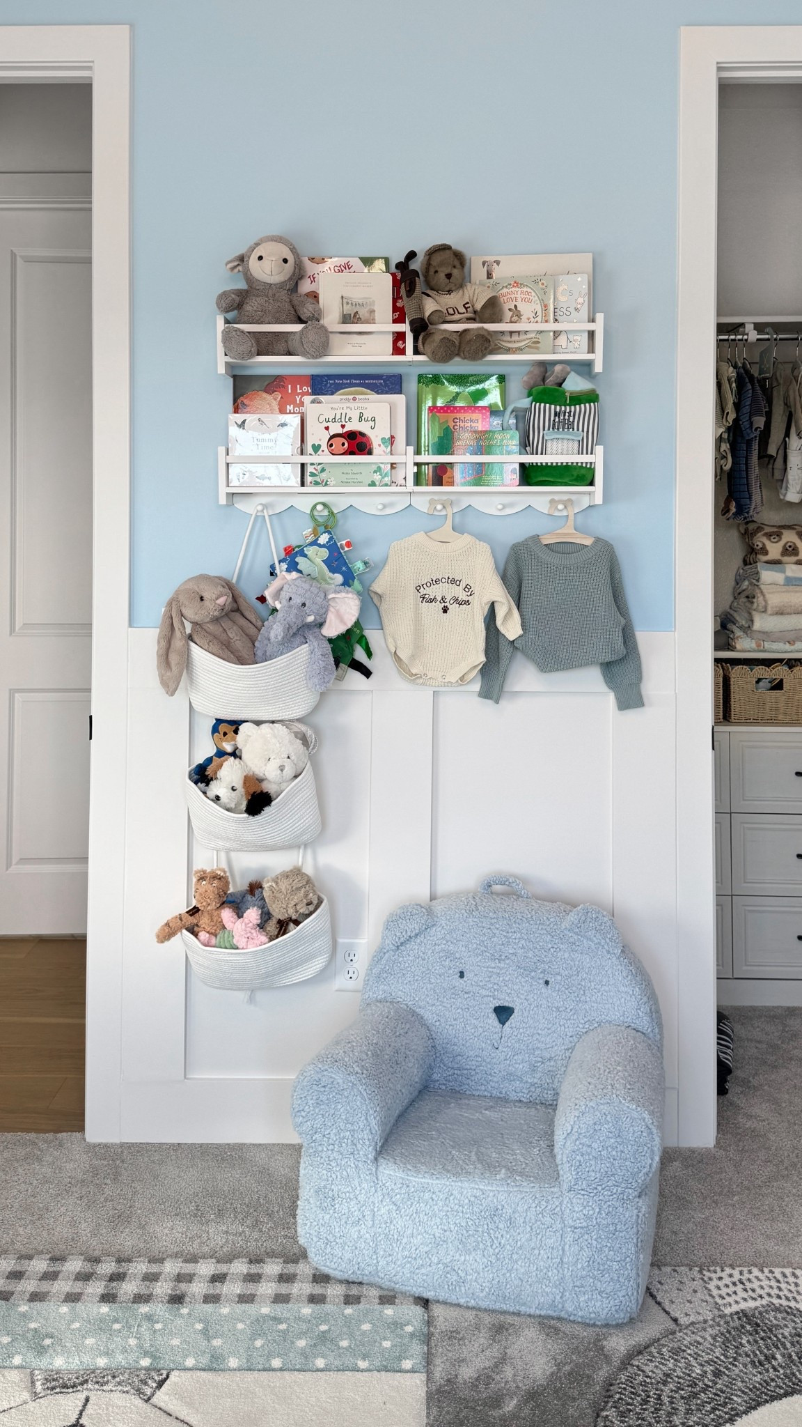 This little nursery corner so far!! Love these cute book shelves, hanging baskets, and teddy bear chair! 