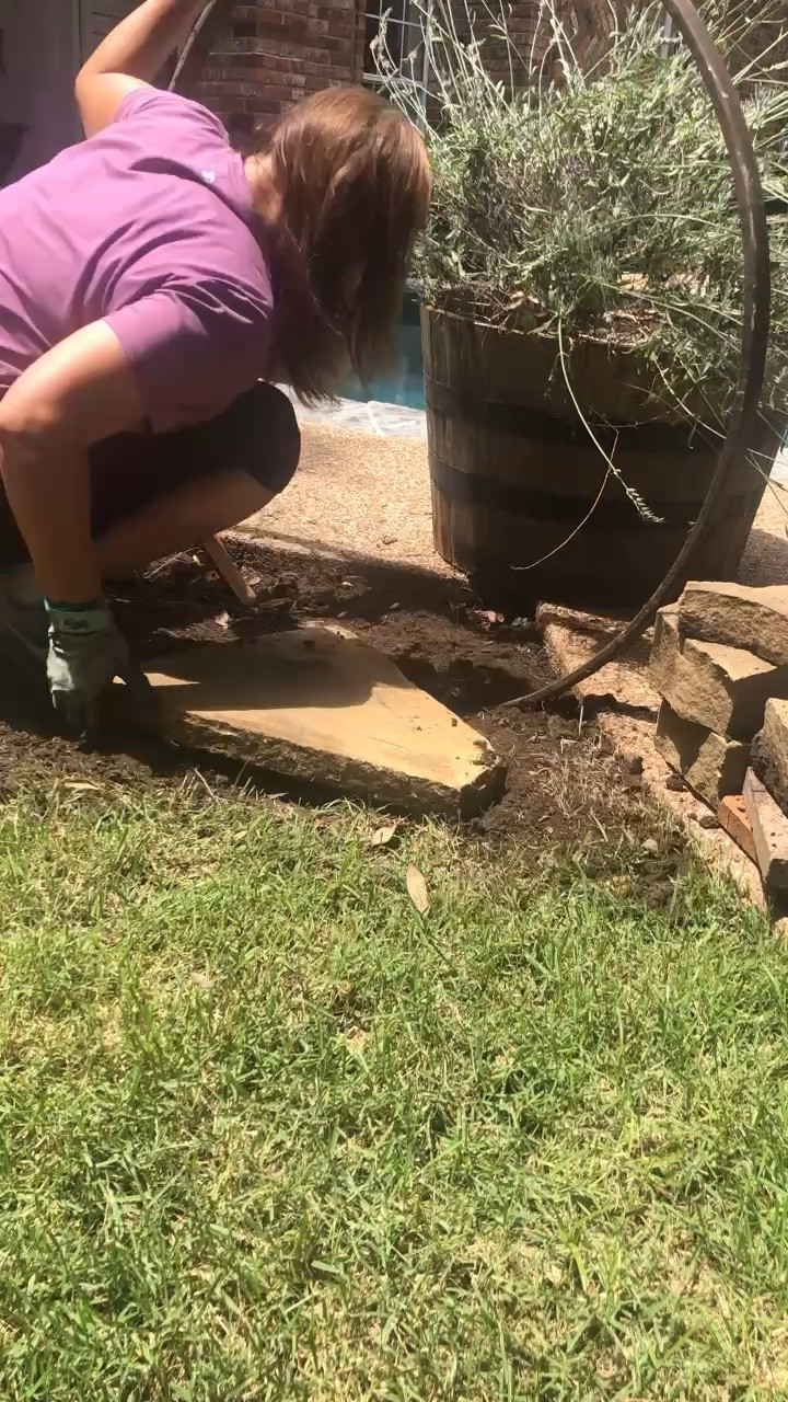 Combining a large wagon wheel rim, flagstone, and large barrel planter to create a stunning garden focal point in my backyard.

#LTKSeasonal #LTKhome