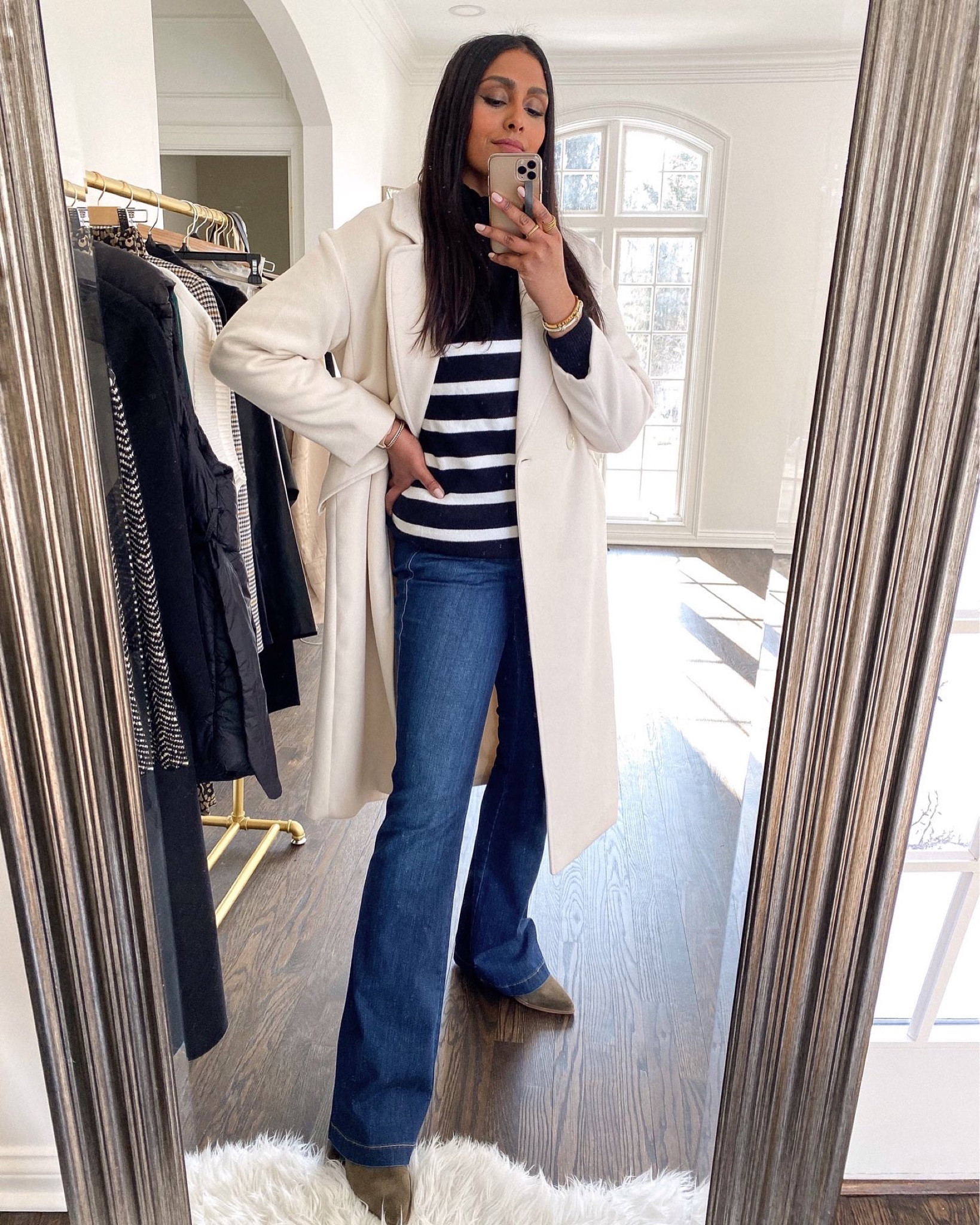 Get the look: striped sweater, spanx flares. H&M white coat. 

#LTKstyletip #LTKSeasonal #LTKunder100