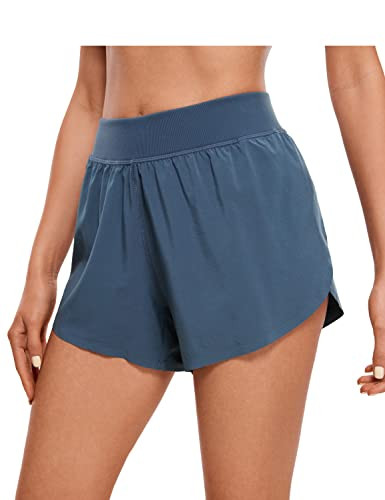 CRZ YOGA Mid Waisted Dolphin Athletic Shorts for Women Lightweight High Split Gym Workout Shorts ... | Amazon (US)