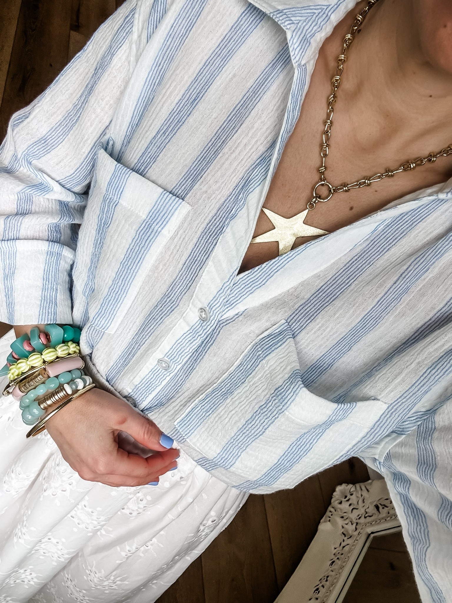 Jewelry code HOUSEOFLEO20. Small gauze button-down shirt. Star necklace. Star charm. Beaded bracelets. Bracelet stack. Summer jewelry. Spring jewelry.

#LTKOver40