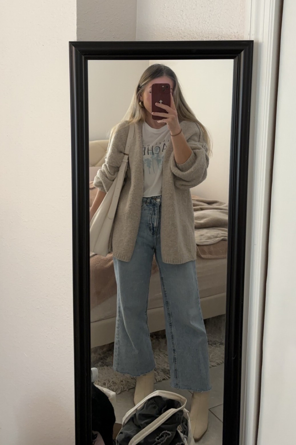 Graphic tee and cardigan outfit with jeans! How to wear your work tee in a new way👏🏼 Wearing size small in the cardigan - it’s a true oversized fit! 

#LTKSeasonal #LTKootd