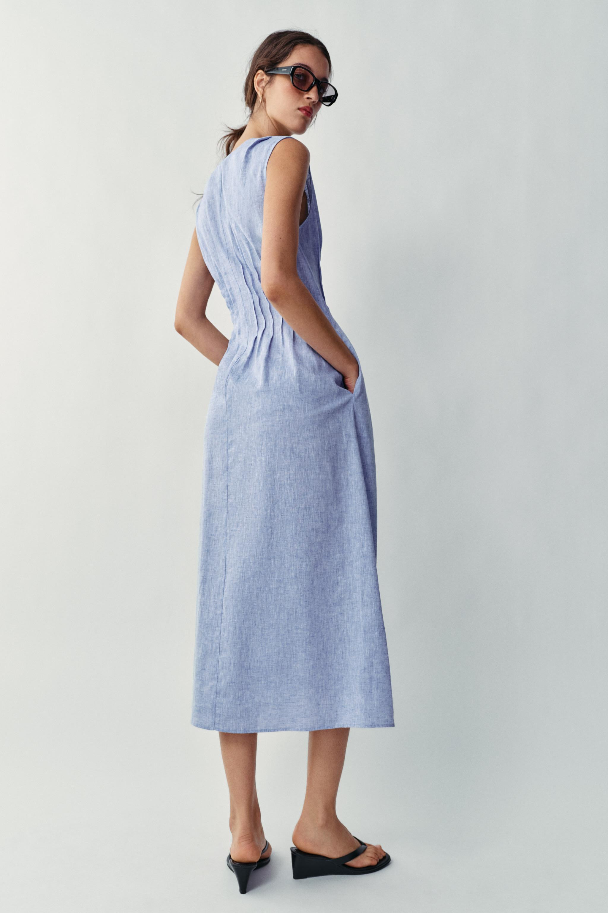 Model height: 183 cmMidi dress made of a linen blend. V-neck with a beaded drawstring and sleevel... | Zara UK