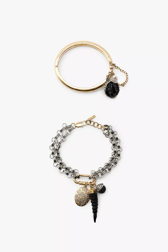 Two-pack of bracelets:- Rigid metal bracelet with raised medallion and bead pendant. Snap and cli... | Zara US