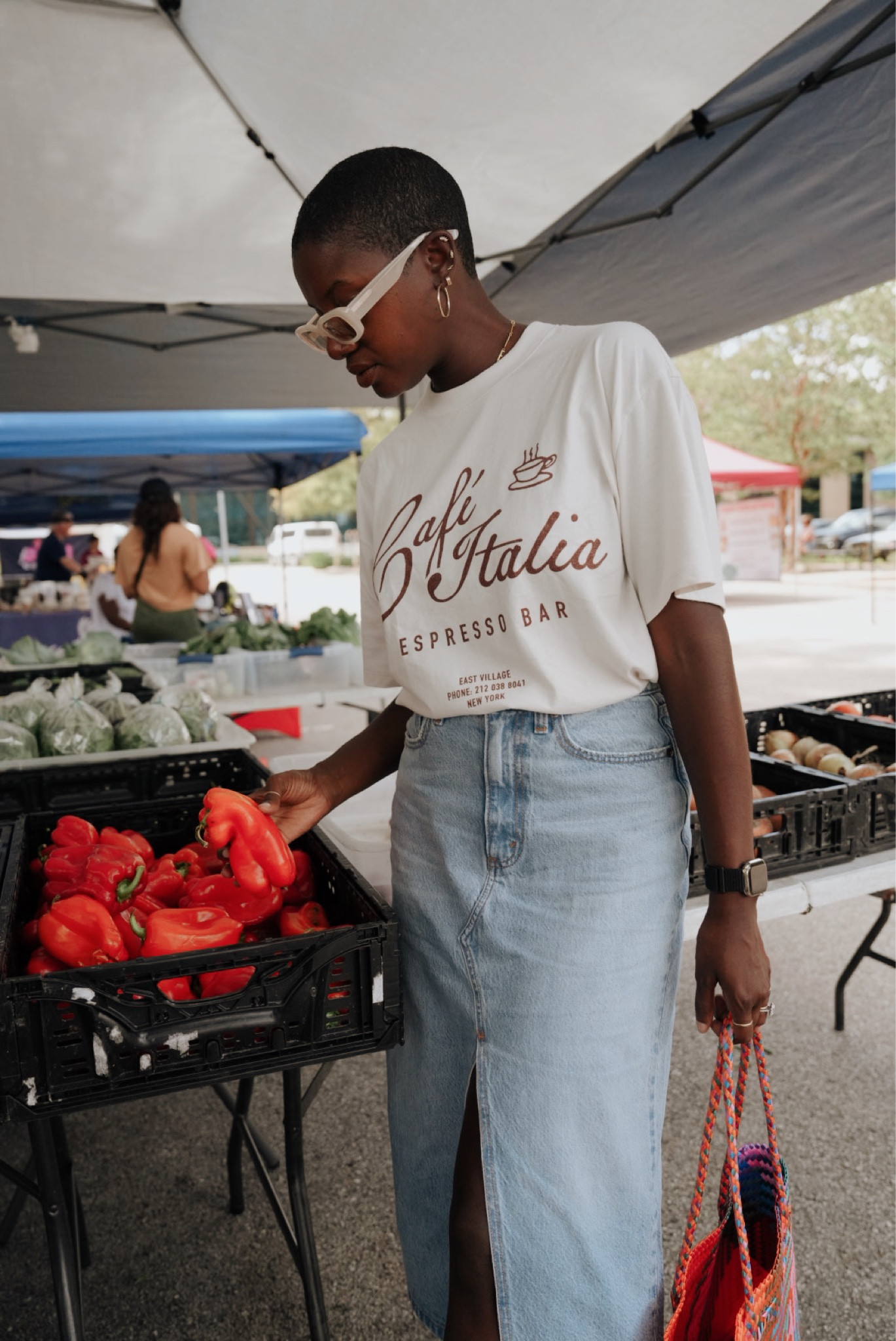 Casual Saturday farmers market outfit! White graphic tee(I’m wearing a large for an oversized fit) , light wash denim skirt, multicolored straw bag, Sorel sport sandals and gold hoop earrings  

#LTKunder100 #LTKtravel #LTKshoecrush