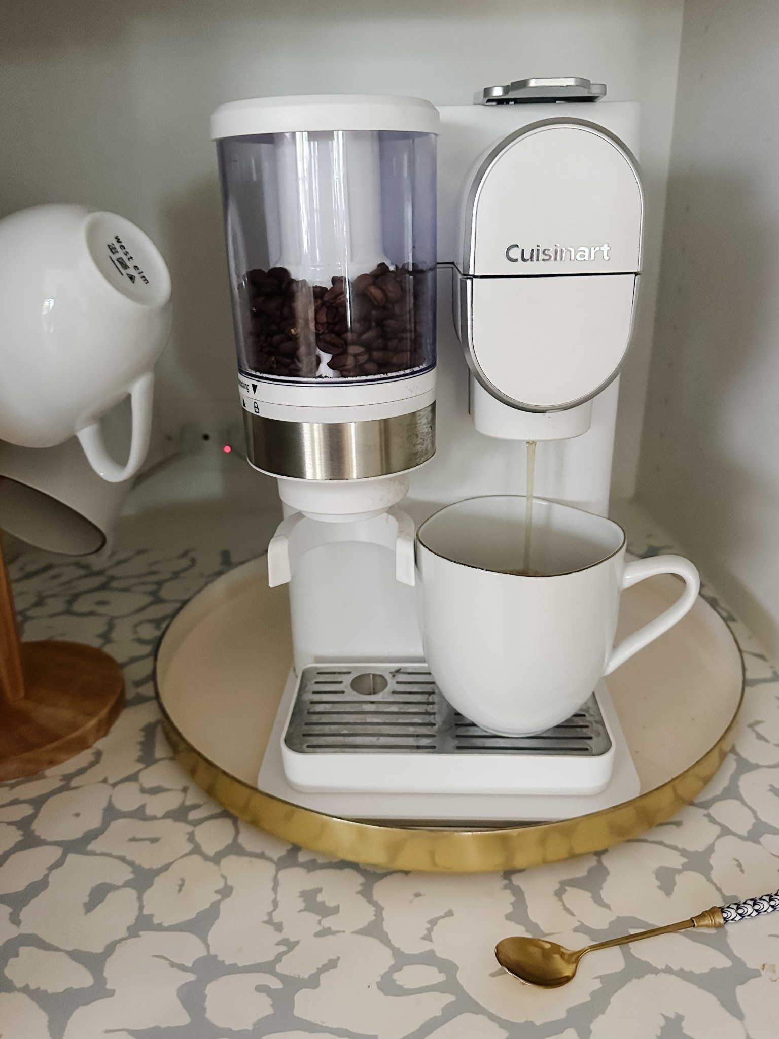Pretty and practical! This sleek white coffee maker brews both K-cups and ground beans—perfect for busy mornings or slow weekends. I love how it looks on the counter (or tucked into a little coffee nook like this!).

Bonus tip: Use a round tray to catch drips and create a built-in coffee station feel.


#LTKHome #CoffeeBarStyle #CuisinartCoffee #KitchenFavorites #CoffeeStationInspo #NeutralKitchen #MorningRoutine

#LTKGiftGuide #LTKHome #LTKStyleTip