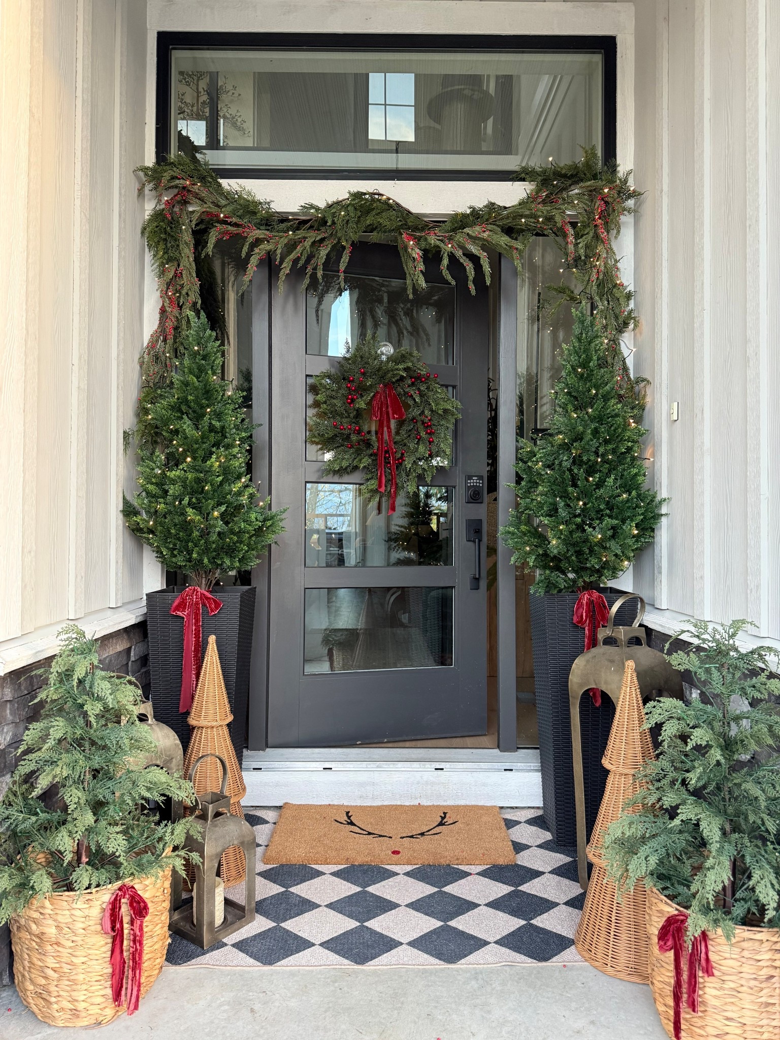 Holiday front porch.. classic Christmas❤️
Lots of greenery with some dark red, and woven pieces to soften things up✨
Love the rattan trees, they’re weatherproof and will last! 


#LTKHoliday #LTKHome #LTKSeasonal