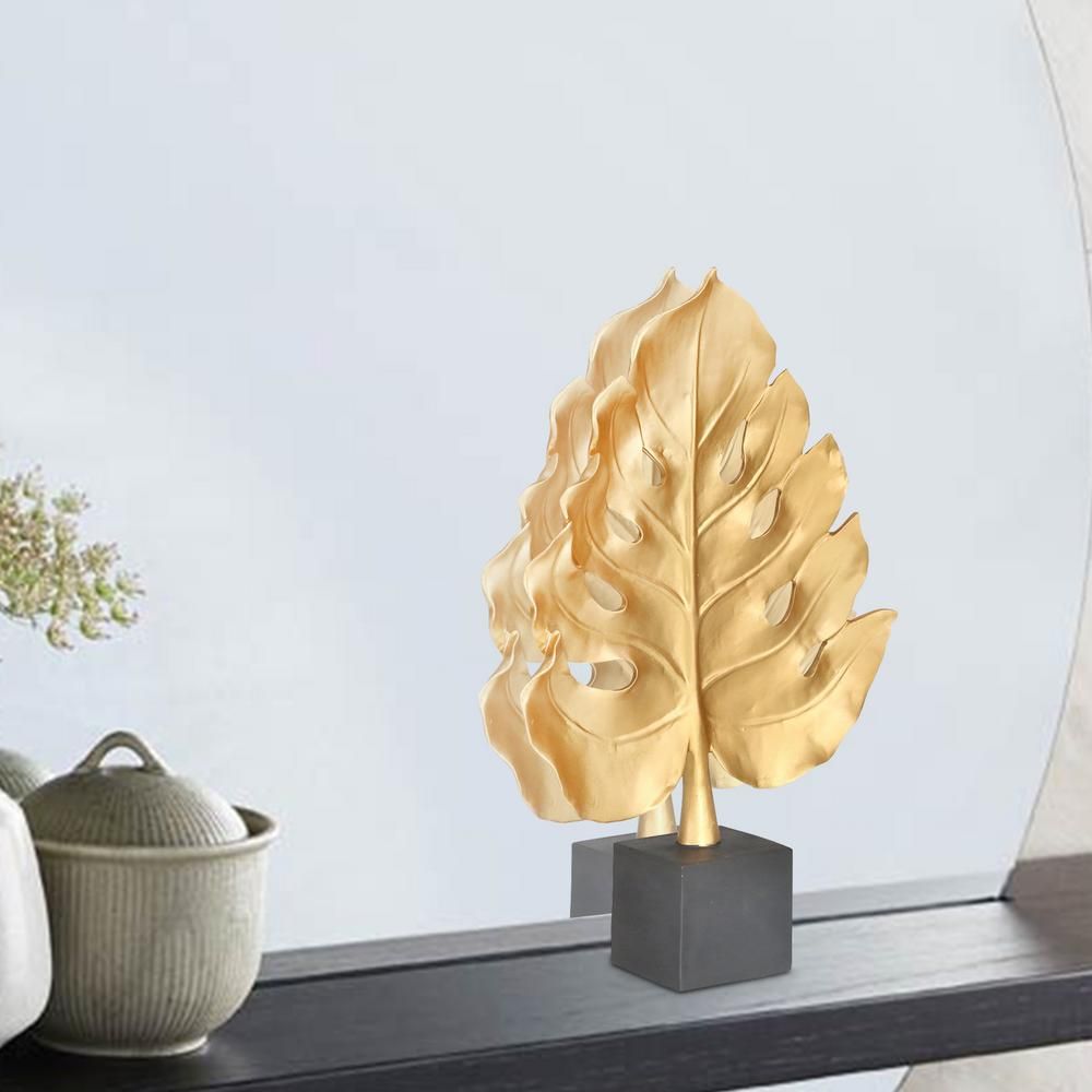 Benjara Gold and Black Polyresin Monstera Leaf Decor Piece with Block Stand | The Home Depot