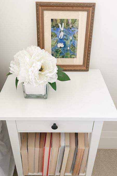 FARMHOUSE SIDE TABLE
,
.
Simple white stand with flowers, art and books 🤍 




#LTKhome #LTKstyletip