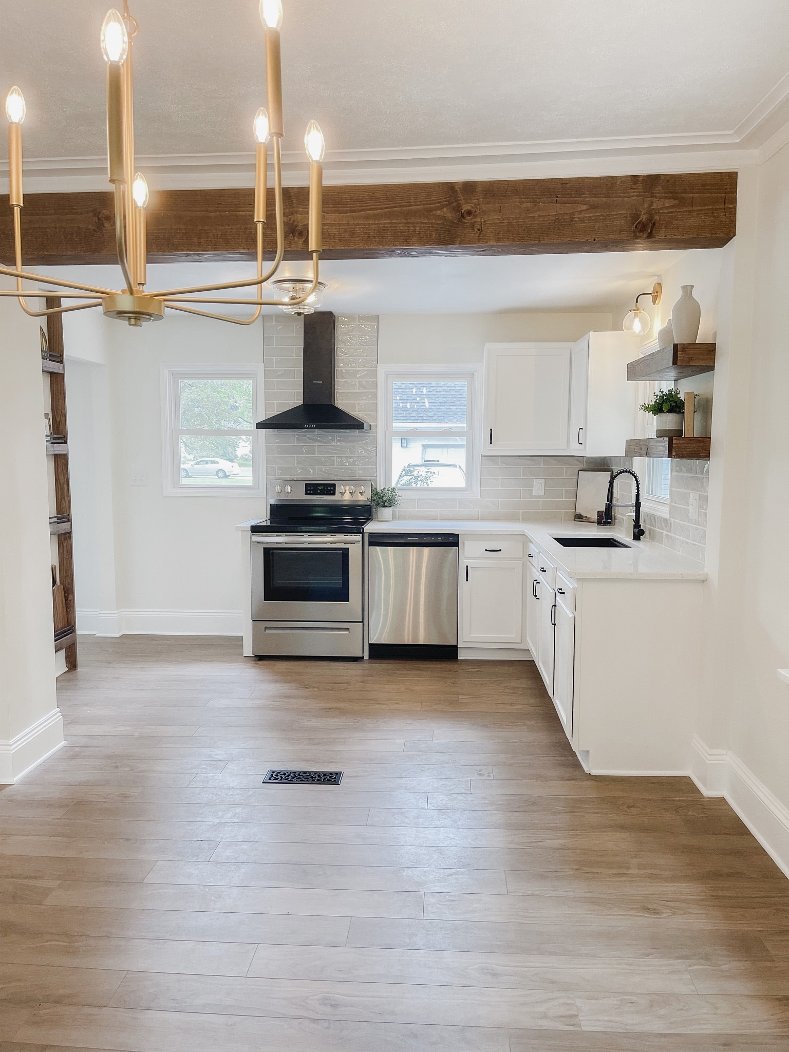 White kitchen // wood accents // stained accents // floating shelves // hood vent //sink // faucet // quartz // kitchen renovation 

#LTKFind #LTKunder100 #LTKhome