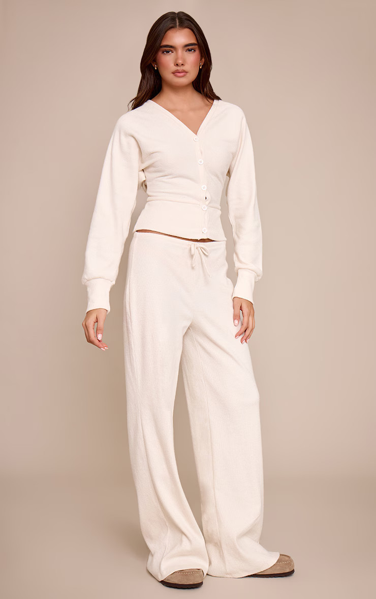 Ecru Soft Ribbed Low Rise Wide Leg Trousers | PrettyLittleThing UK
