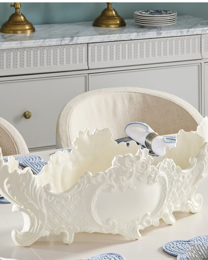 BAROQUE CENTERPIECE
ON SALE $160 down from $229
Makes for the most beautiful floral centerpiece or keep it empty!

Our Baroque Centerpiece was inspired by the highly ornate decorative style so popular throughout Europe in the 17th and early 18th centuries. Beautiful filled with lemons or dried florals, this elegant vessel was handmade exclusively for us in the picturesque Northern Italian town of Bassano del Grappa, where fine ceramics have been produced since the 17th century. Using a special white clay called terraglia dolce ("sweet earthenware") found in the nearby Dolomite mountains, skilled family artisans meticulously hand shape and carve each Centerpiece to create the sumptuously scrolled acanthus and lattice relief on both sides. Baked at 1000 degrees Celsius, the ceramic shape comes out of the kiln resembling smooth porcelain, perfect for hand applying the bisque ivory finish. Each Baroque Centerpiece is stamped underneath with "Hand Made in Italy" and signed by the artist.