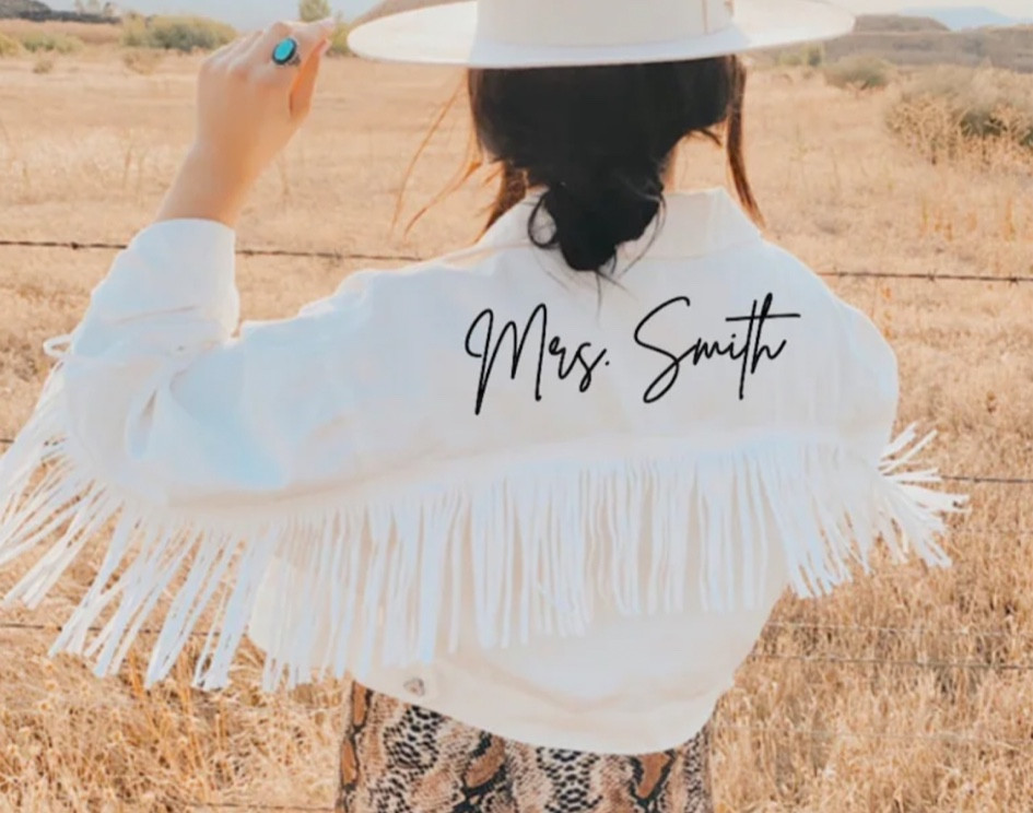 Bridal fringe jacket by SymbolicImports
 
White Fringe Mrs Personalized Denim Jacket | Custom Bride Jean Jacket | Wedding Jacket | Bridal Engagement Gift | Cowgirl Nashville Bachelorette

#LTKstyletip #LTKunder50 #LTKwedding