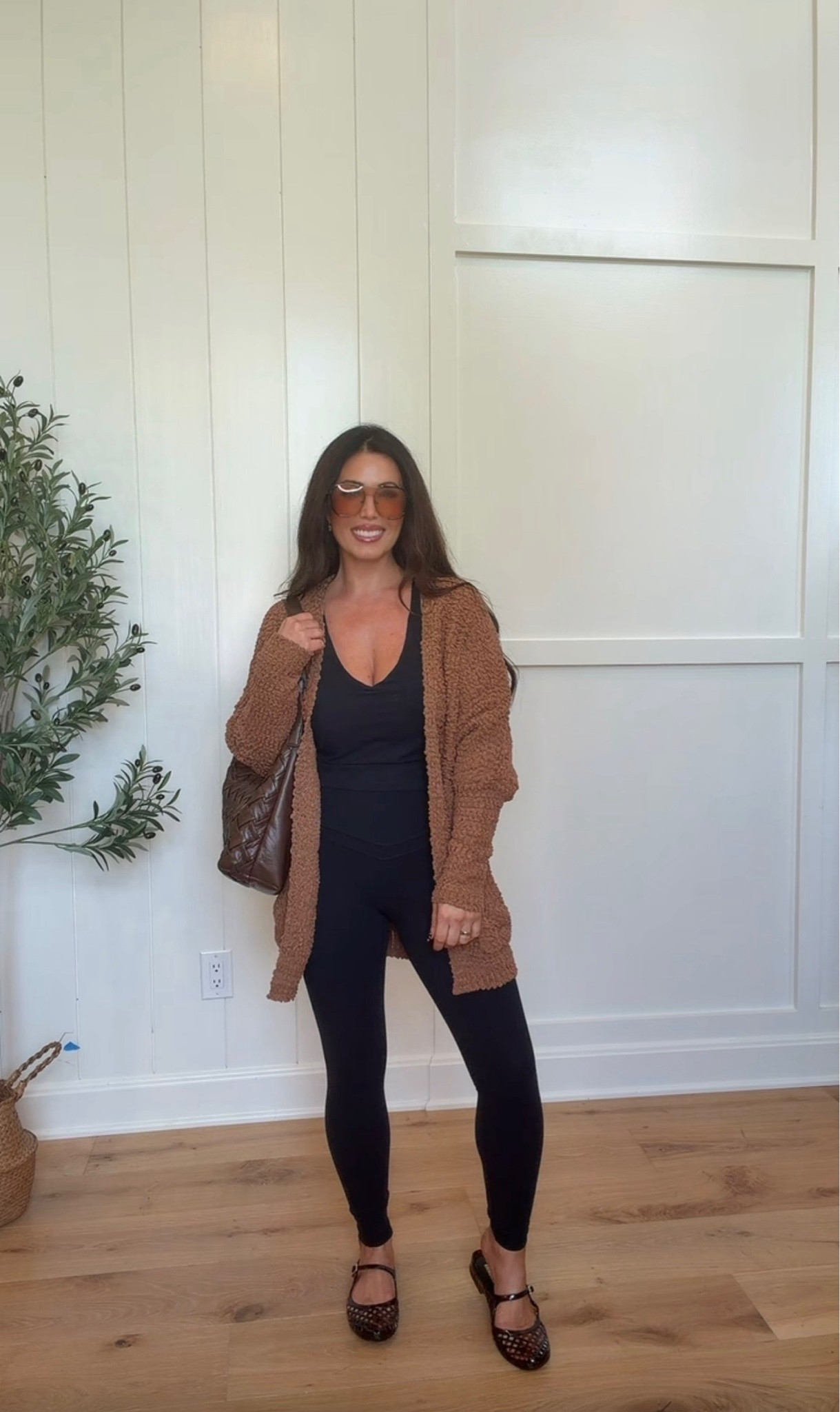 The easiest fall layering look! 🤎 This cozy brown cardigan over a sleek black one-piece is comfortable while still looking so put together. Add flats and a brown bag for an effortless outfit you can wear from errands to lunch!
#cardigan outfit, black jumpsuit outfit, fall layering outfit, brown cardigan, casual fall fashion, mom outfit ideas, comfy fall outfit, women’s everyday style