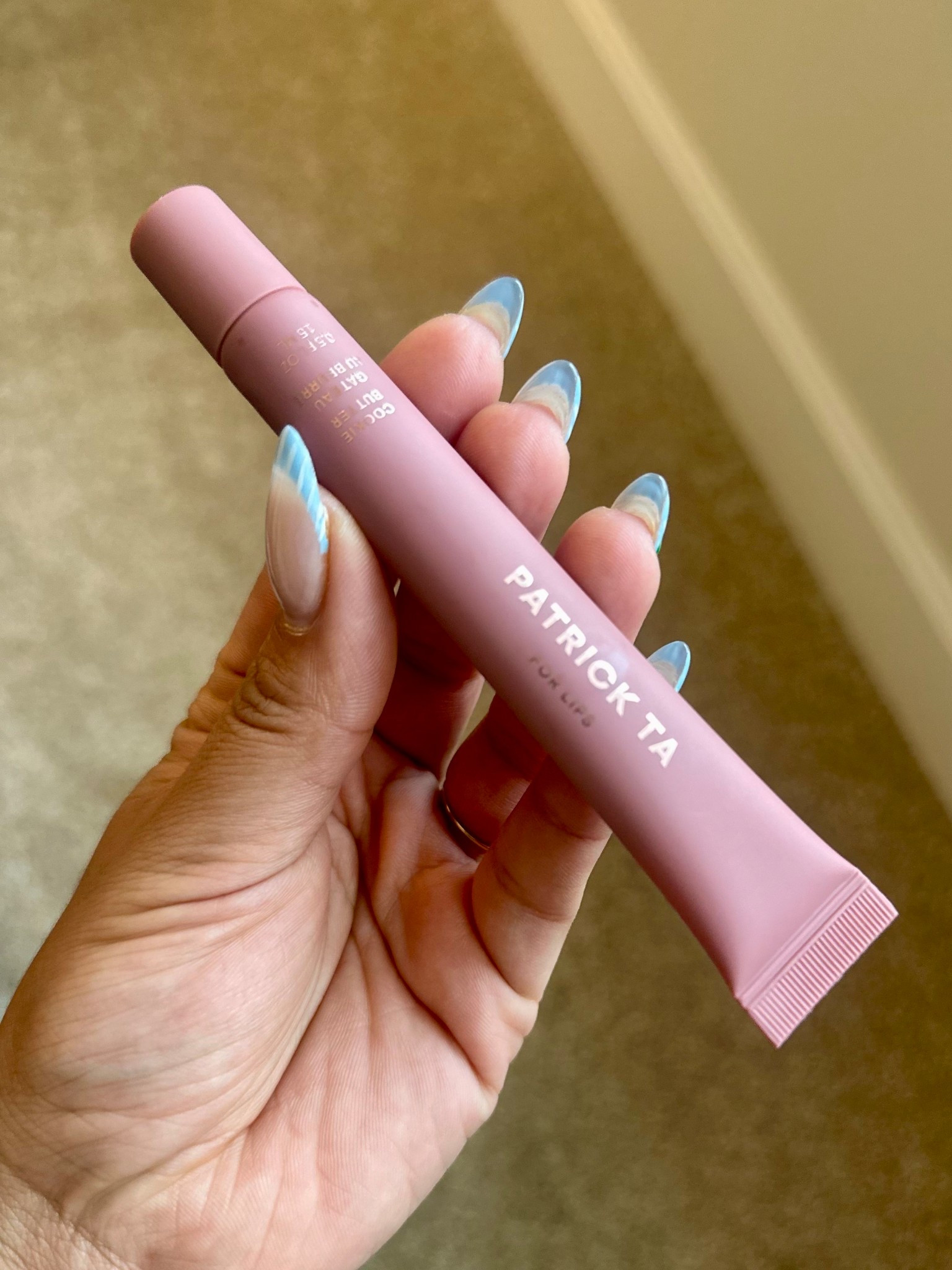 Obsessed is an understatement. This lip gloss has officially entered my top 3 favorite lip glosses ever and honestly… it might be number one.

The Patrick Ta Moisture Smoothing Plumping Lip Balm in Cookie Butter is thick, super hydrating, and gives the prettiest sheer mauve tint that looks good with literally everything.

It’s one of those glosses that makes your lips look juicy, smooth, and expensive . And I don’t know what it is about this slim tube… but it just feels GOOD in your hand.

If you love a hydrating lip gloss, sheer mauve lip gloss, or that “your lips but better” look… this is it.

#patrickta #lipglossobsessed #beautyfinds #ltkbeauty #sephorafinds #sheerlipgloss #mauvelips #glossylips #everydaymakeup #lipglossreview

#LTKBeauty