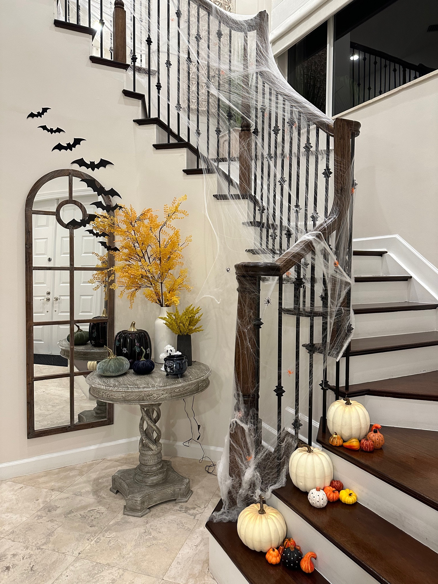 Halloween decor for our entryway! My kids loved helping decorate 😊 I love using the spiderwebs. They’re easy to use and look so cool! Add some plastic spider rings to complete the look 👻

#LTKSeasonal #LTKHalloween #LTKhome